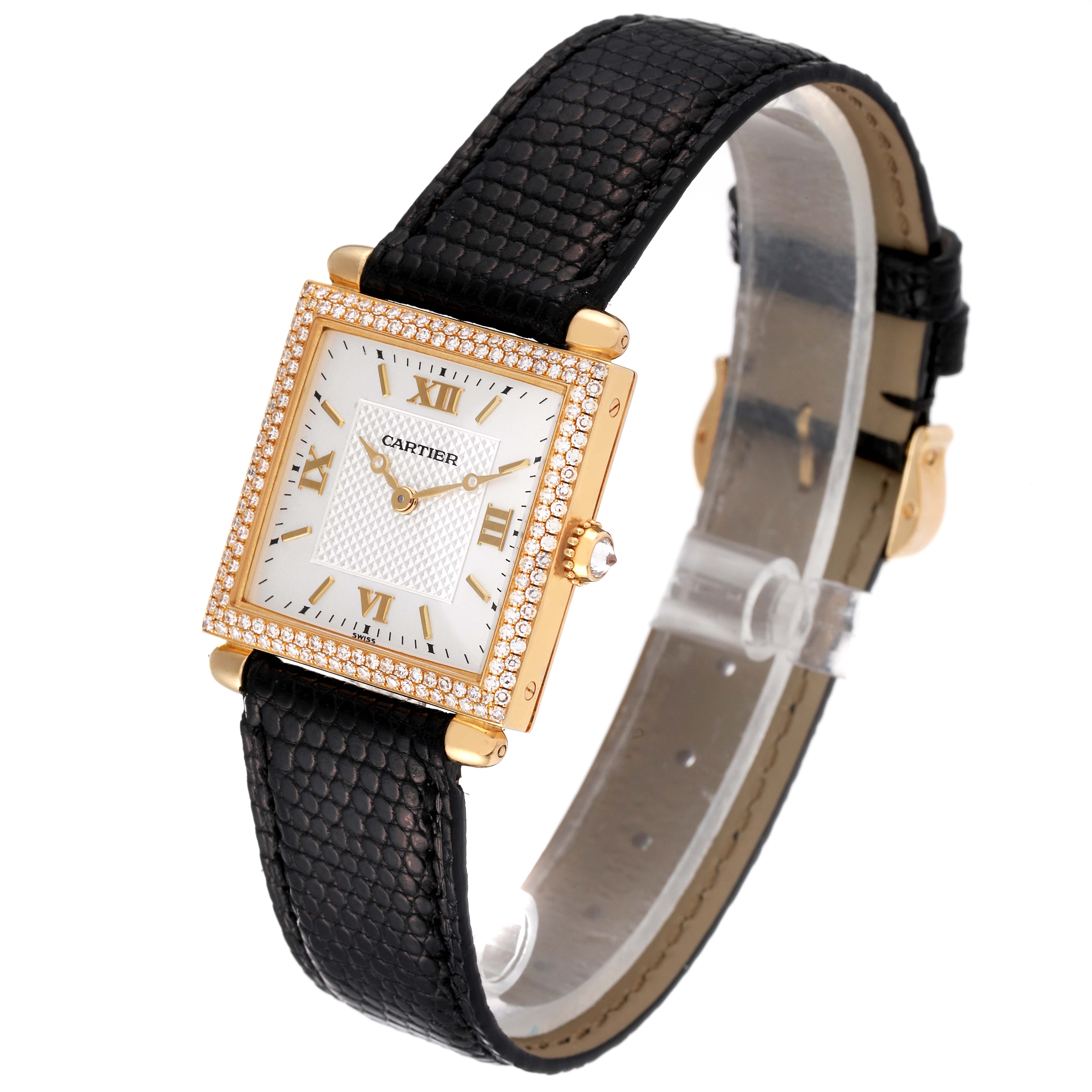 This image shows a Cartier Tank Obus WB800351 Women
s Yellow Gold Silver Dial WB800351 Women
s Yellow Gold Silver Dial watch at a three-quarter angle, highlighting its gold case, white dial, and black leather strap.