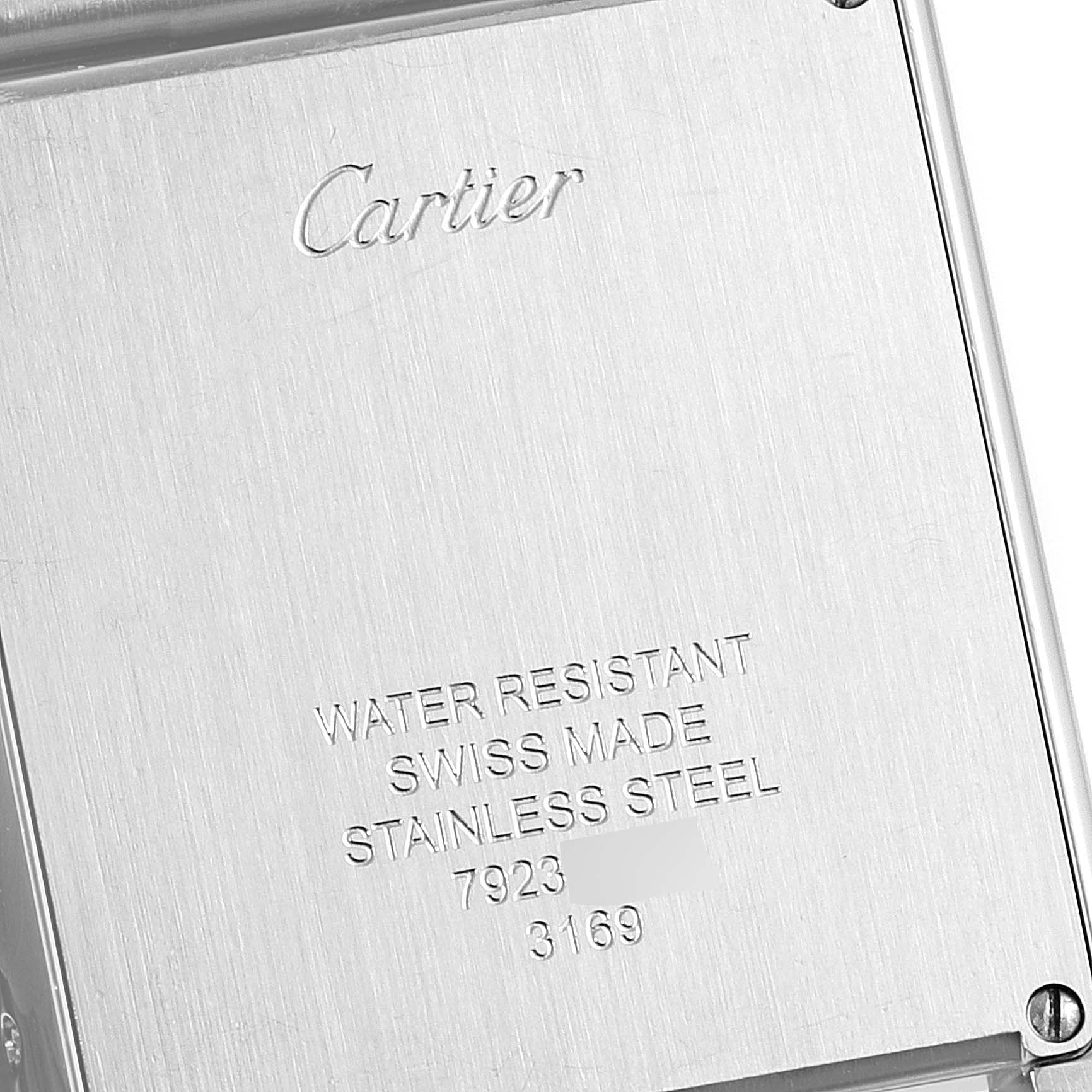 This image shows the back casing of a Cartier Tank Solo W5200014 Men
s Stainless Steel Silver Dial W5200014 Men
s Stainless Steel Silver Dial watch, highlighting engravings about its material and water resistance.