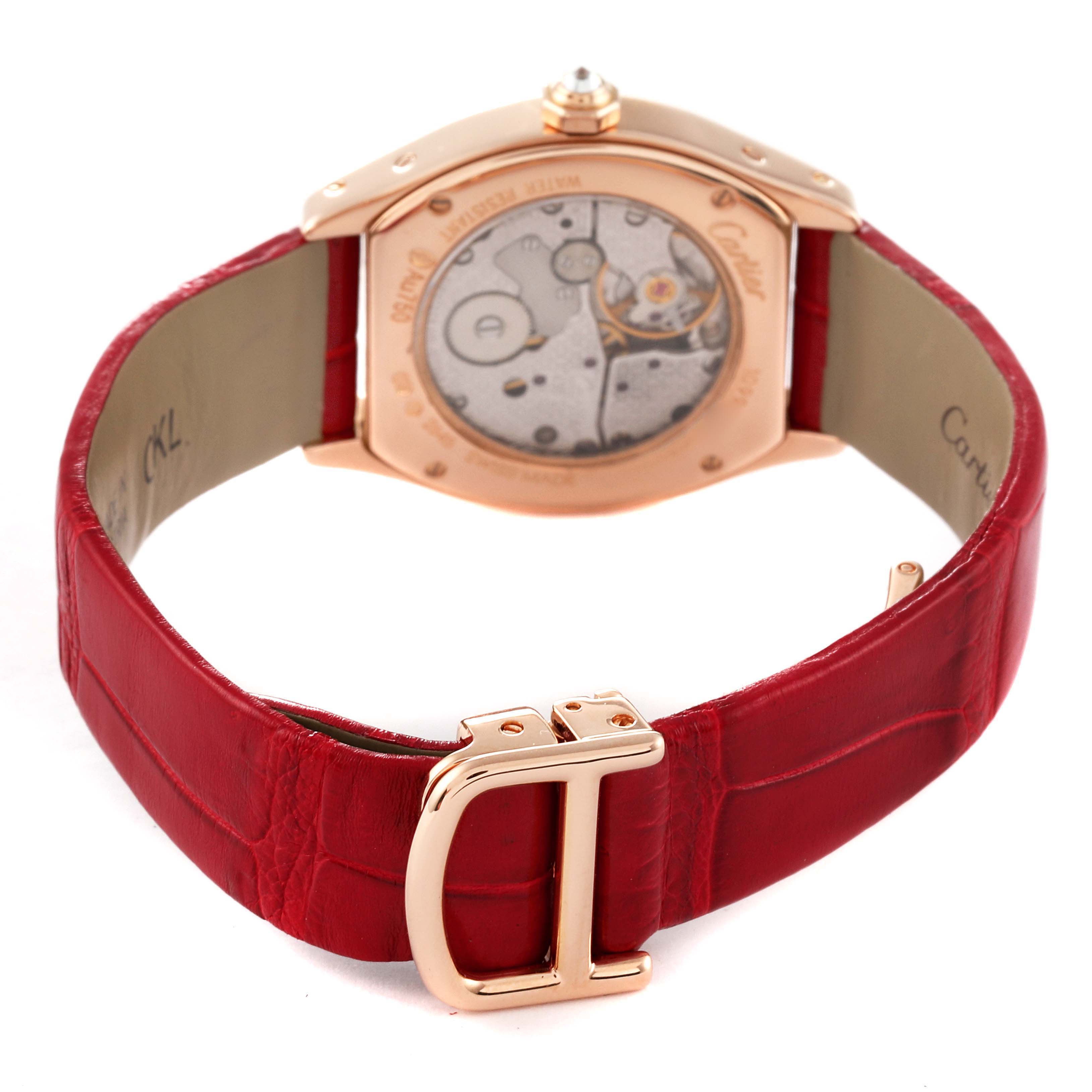 The image shows the rear view of a Cartier Tortue WA507031 Women's Rose Gold Silver Dial WA507031 Women's Rose Gold Silver Dial watch, featuring the movement, red leather strap, and gold clasp.