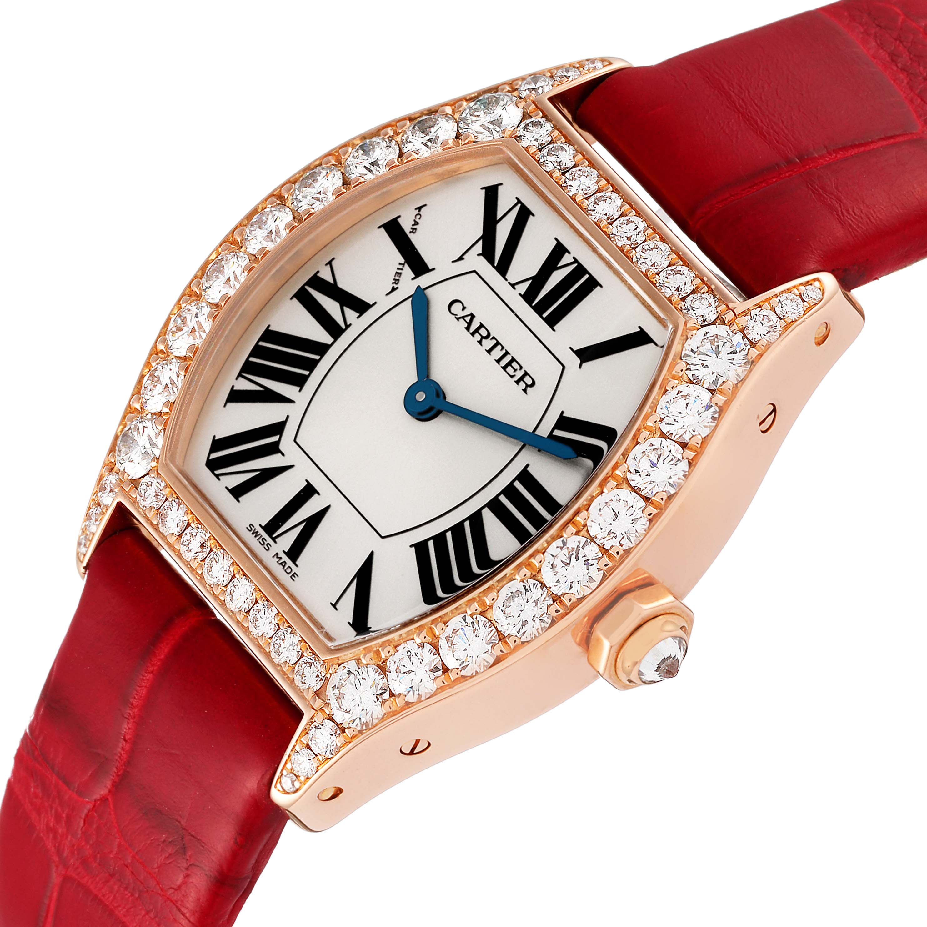 This image shows a close-up angle of the Cartier Tortue WA507031 Women's Rose Gold Silver Dial WA507031 Women's Rose Gold Silver Dial watch, highlighting its face, diamond bezel, and red leather strap.