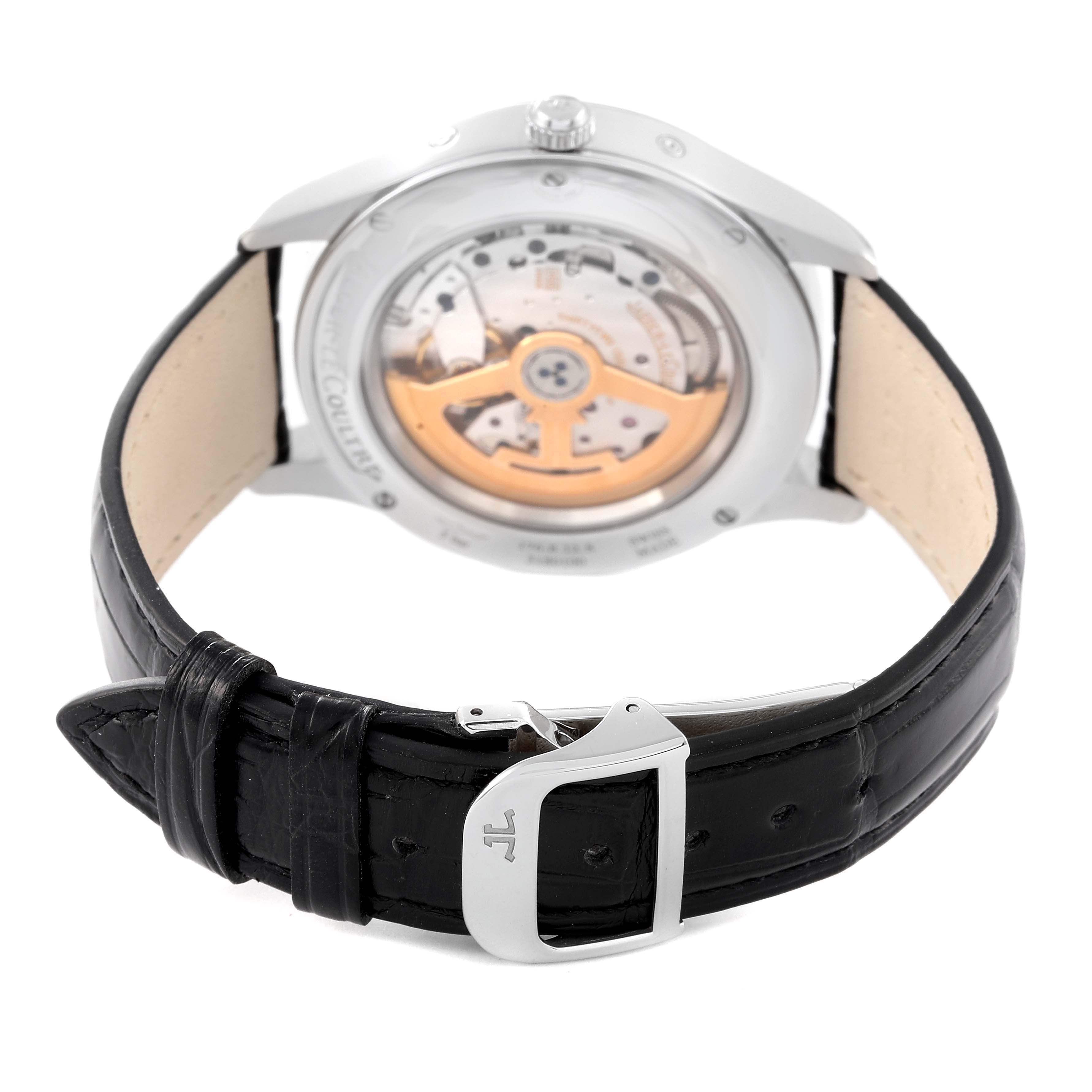 The image shows the back view of a Jaeger LeCoultre Master Q1558421 Men
s Stainless Steel Silver Dial Q1558421 Men
s Stainless Steel Silver Dial model watch, highlighting its open case back, black leather strap, and clasp.