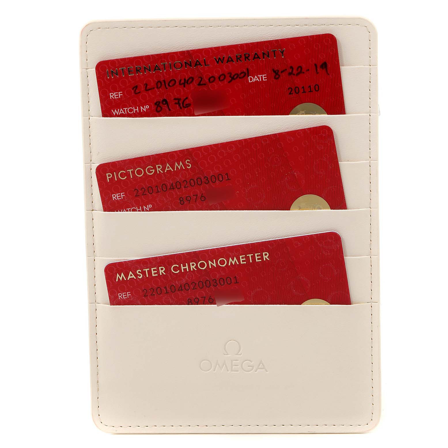 The image shows a cardholder containing three cards (International Warranty, Pictograms, and Master Chronometer) for an Omega Seamaster 220.10.40.20.03.001 Men
s Stainless Steel Blue Dial 220.10.40.20.03.001 Men
s Stainless Steel Blue Dial watch.