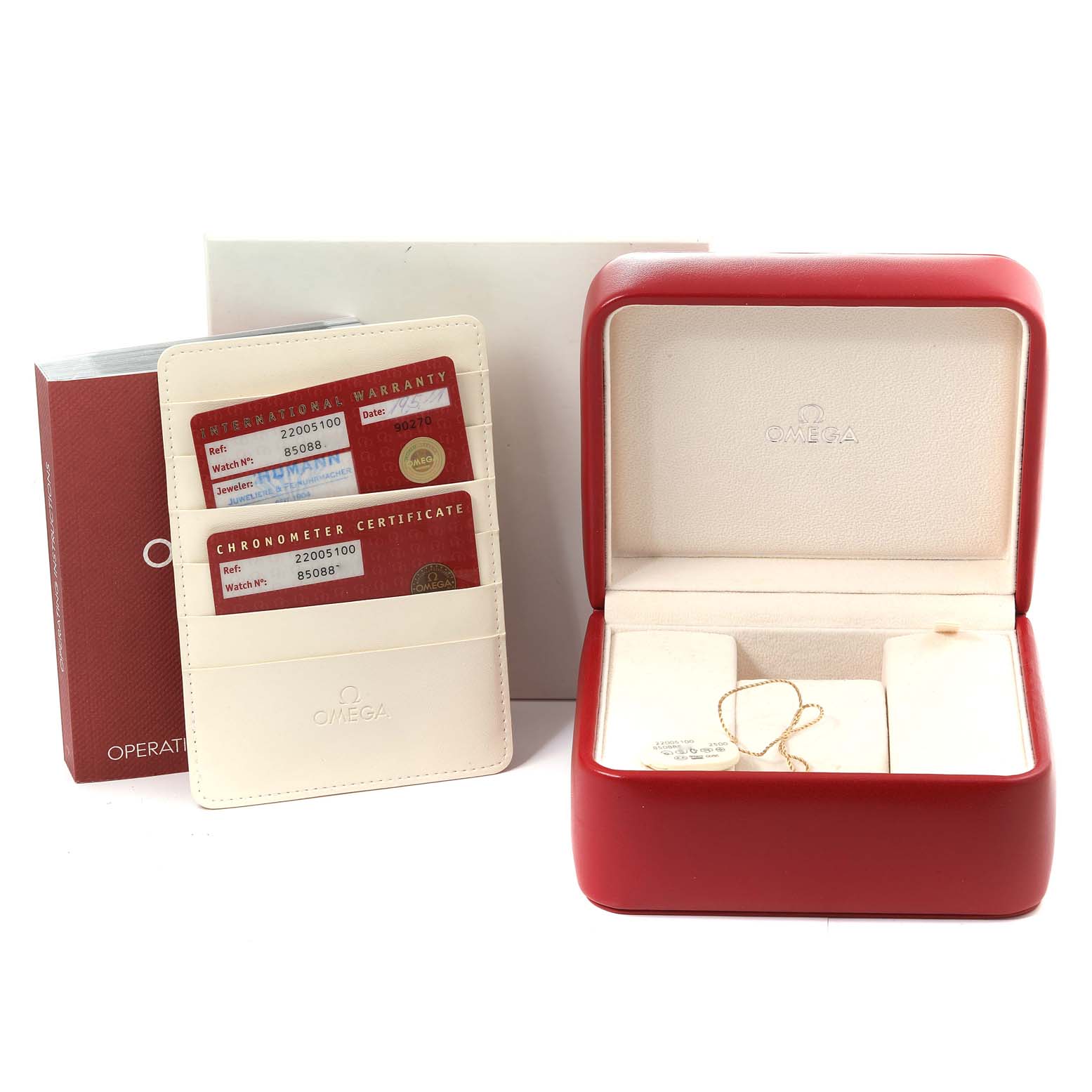 The image shows a red Omega Planet Ocean 2200.51.00 Men
s Stainless Steel Black Dial 2200.51.00 Men
s Stainless Steel Black Dial watch box, international warranty cards, and an instruction manual.