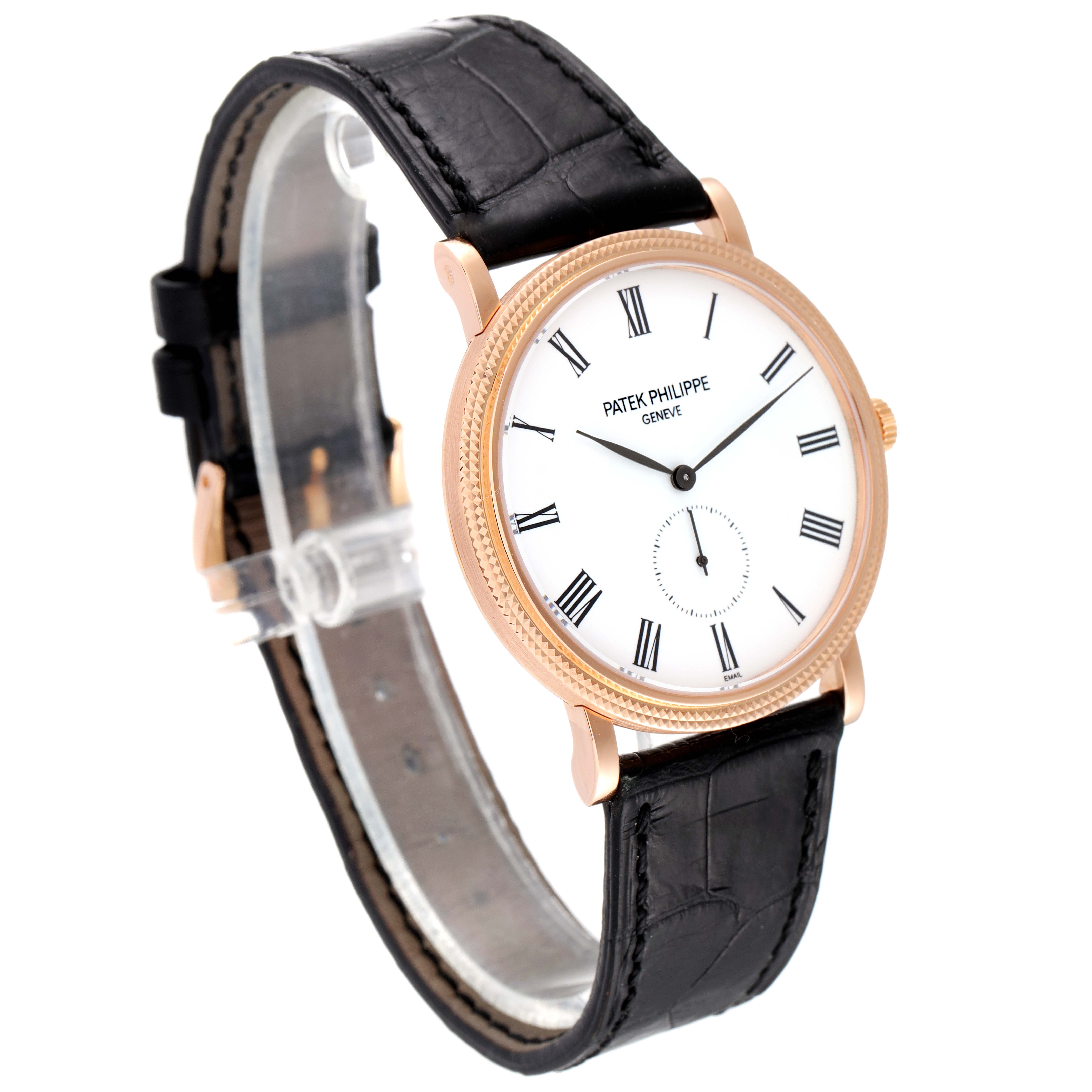 This image shows a Patek Philippe Calatrava 5116R Men
s Rose Gold White Dial 5116R Men
s Rose Gold White Dial watch at an angle highlighting its face, bezel, and leather strap.