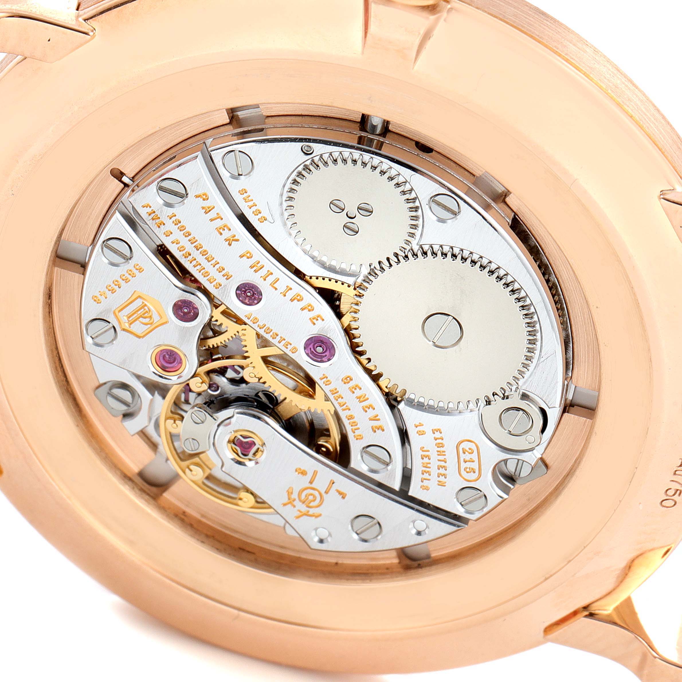 The image shows the backside of a Patek Philippe Calatrava 5116R Men
s Rose Gold White Dial 5116R Men
s Rose Gold White Dial watch, revealing its intricate movement mechanism.