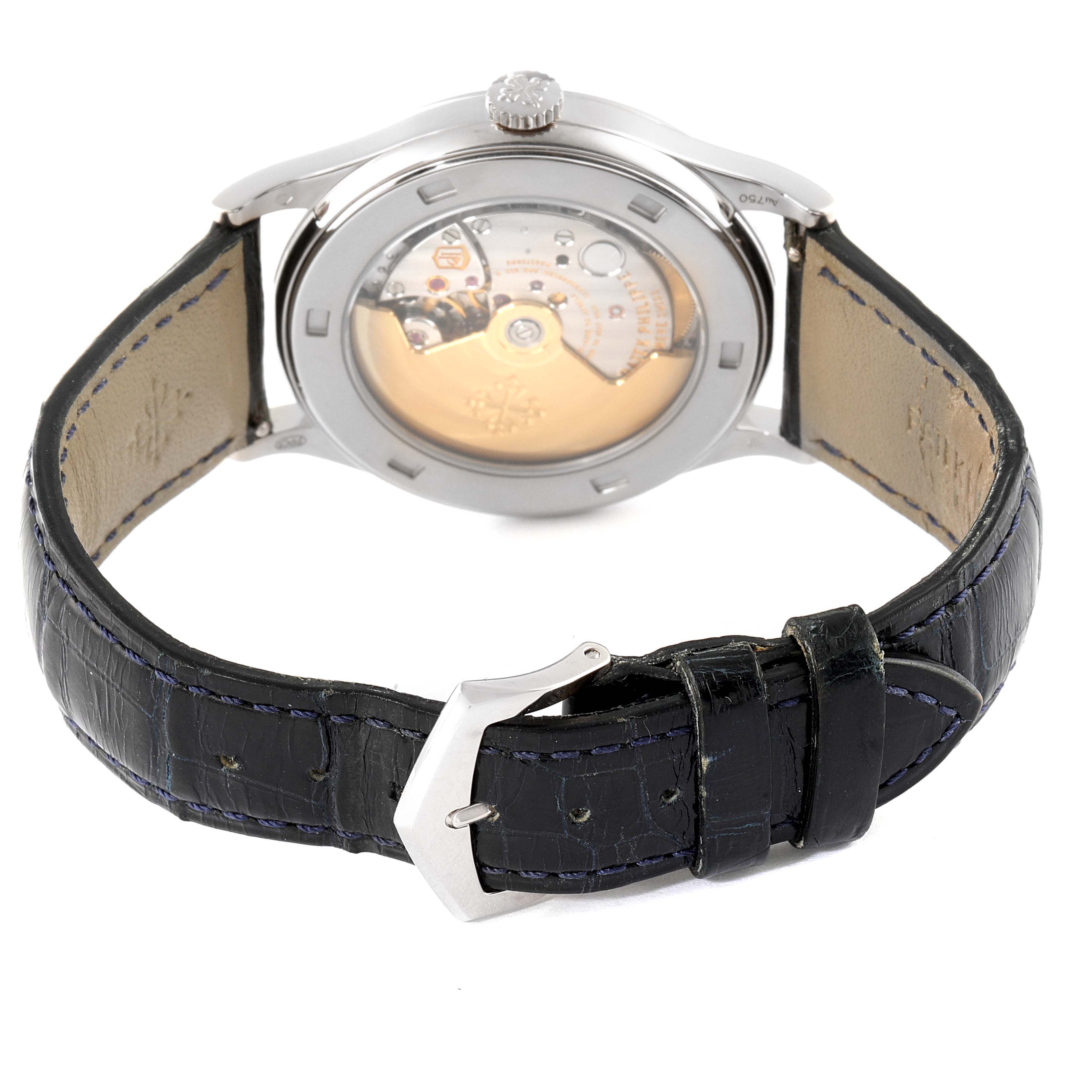 The image shows the back view of a Patek Philippe Calatrava 5296G-001 Men's White Gold Silver Dial 5296G-001 Men's White Gold Silver Dial watch, highlighting its leather strap and exposed movement.