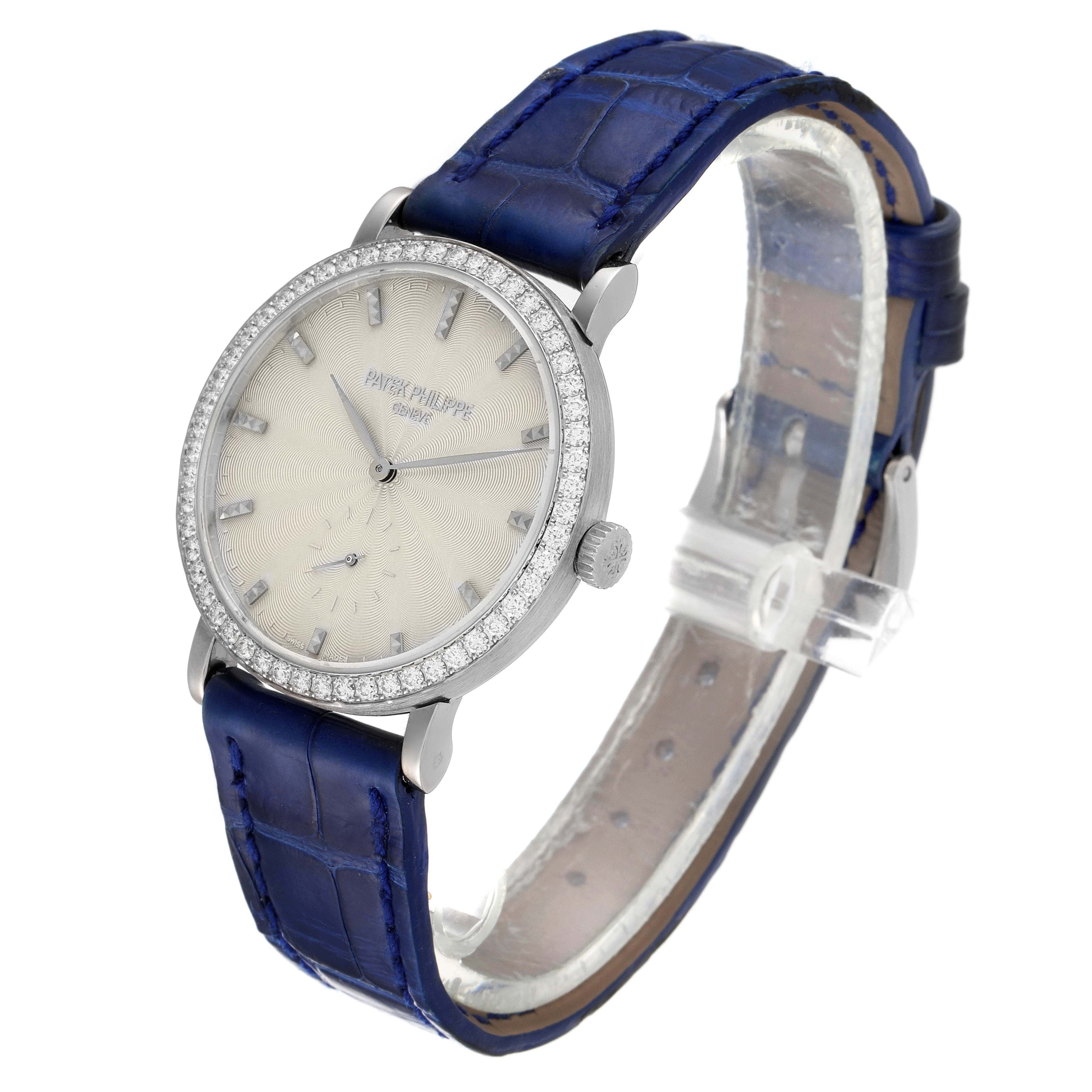 The image shows a Patek Philippe Calatrava 7120G Women's White Gold Beige Dial 7120G Women's White Gold Beige Dial watch at a side angle, highlighting its face, crown, and blue strap.
