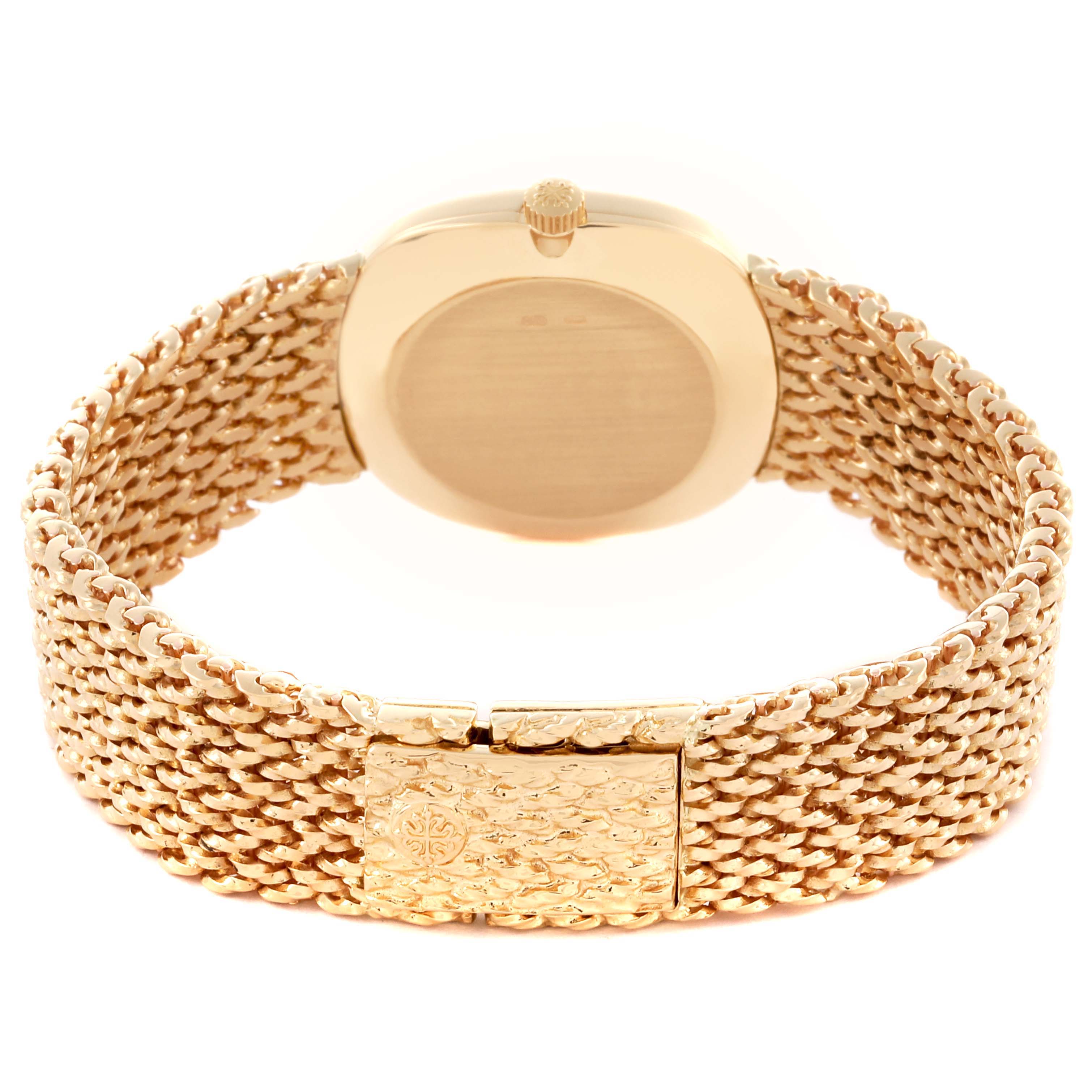 The image shows the back of the Patek Philippe Golden Ellipse 4223 Women's Yellow Gold Blue Dial 4223 Women's Yellow Gold Blue Dial watch, highlighting the case back, crown, and woven bracelet.