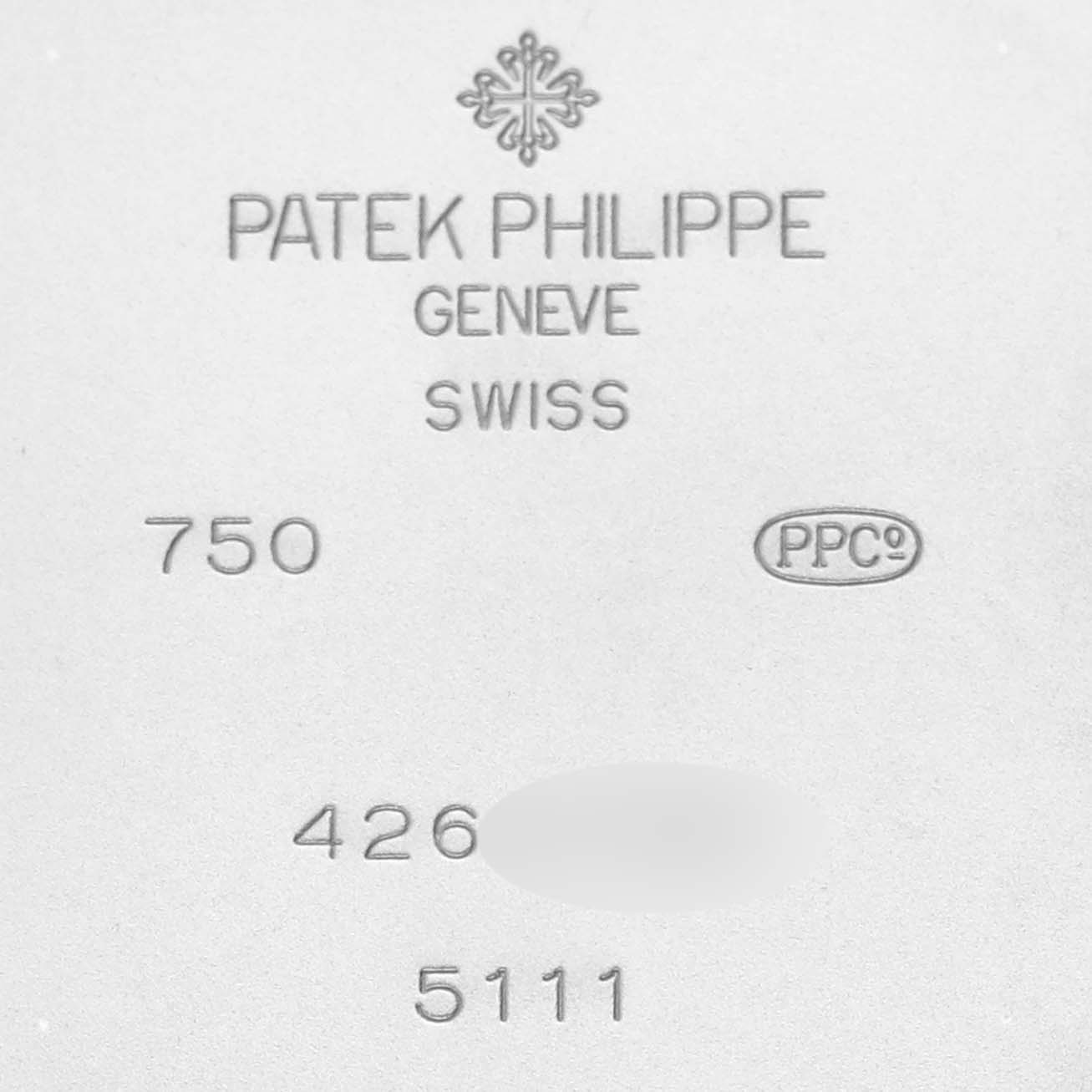 The image shows the inscriptions on the back plate of a Patek Philippe Gondolo 5111G-001 Men's White Gold Silver Dial 5111G-001 Men's White Gold Silver Dial watch.