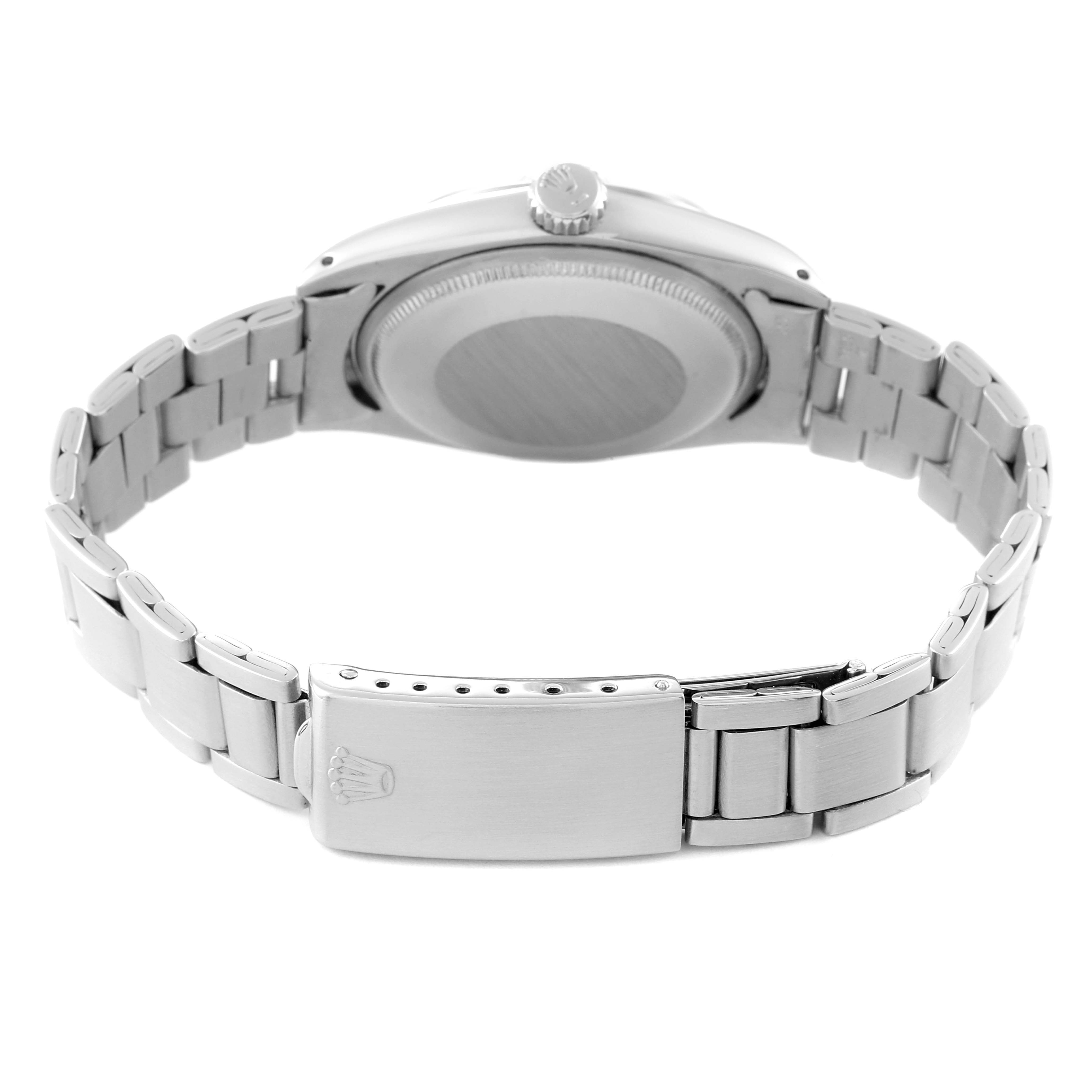 The Rolex Air-King 5700 Men's Stainless Steel Silver Dial 5700 Men's Stainless Steel Silver Dial watch is shown from the back, featuring the bracelet, clasp, case back, and crown.