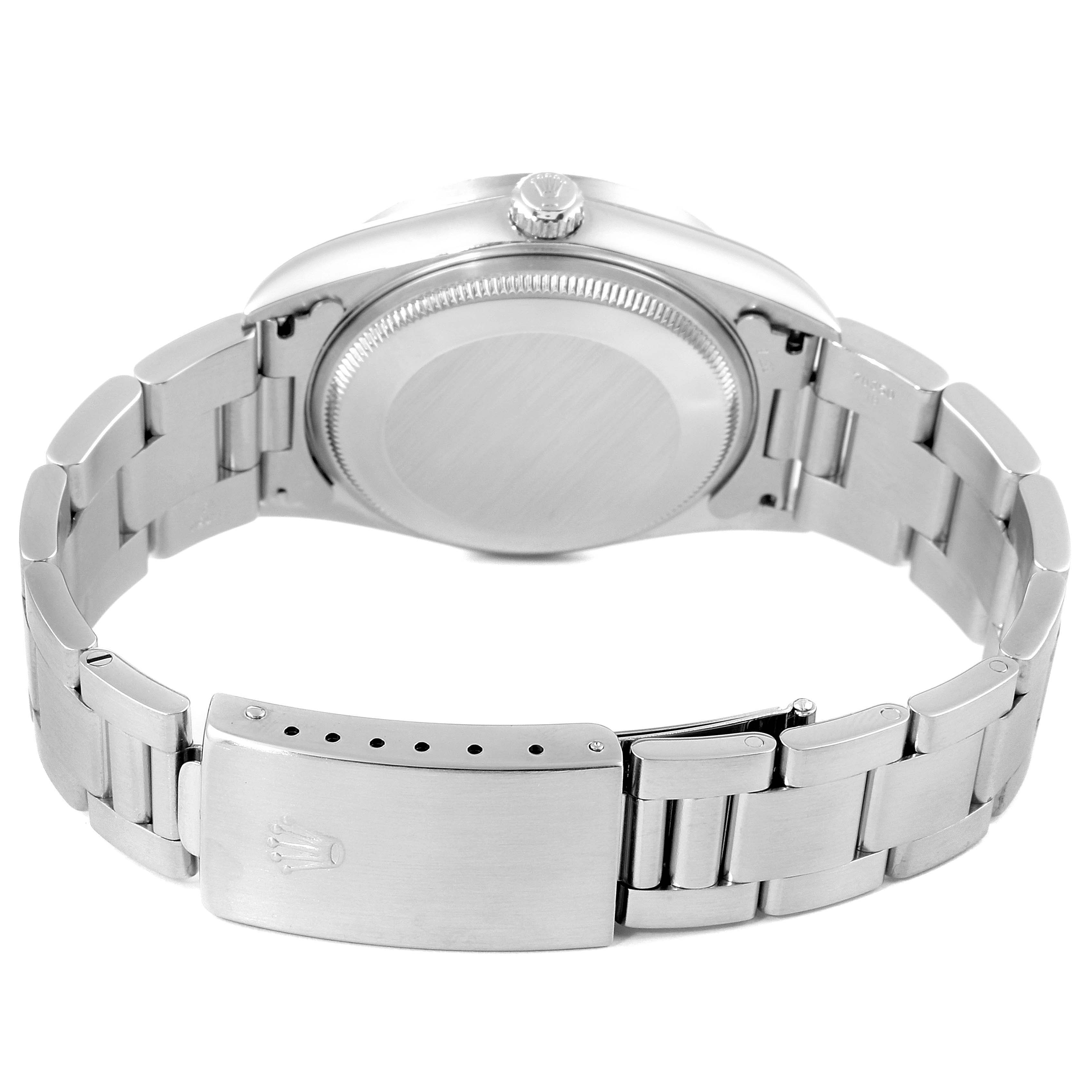 The image shows the back view of a Rolex Air-King 14010 Men's Stainless Steel Silver Dial 14010 Men's Stainless Steel Silver Dial watch, including the case back, crown, and bracelet with clasp.
