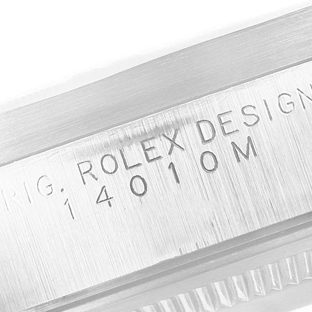 The image shows a close-up of the model number engravings on the case side of a Rolex Air-King 14010 Men's Stainless Steel Silver Dial 14010 Men's Stainless Steel Silver Dial watch.