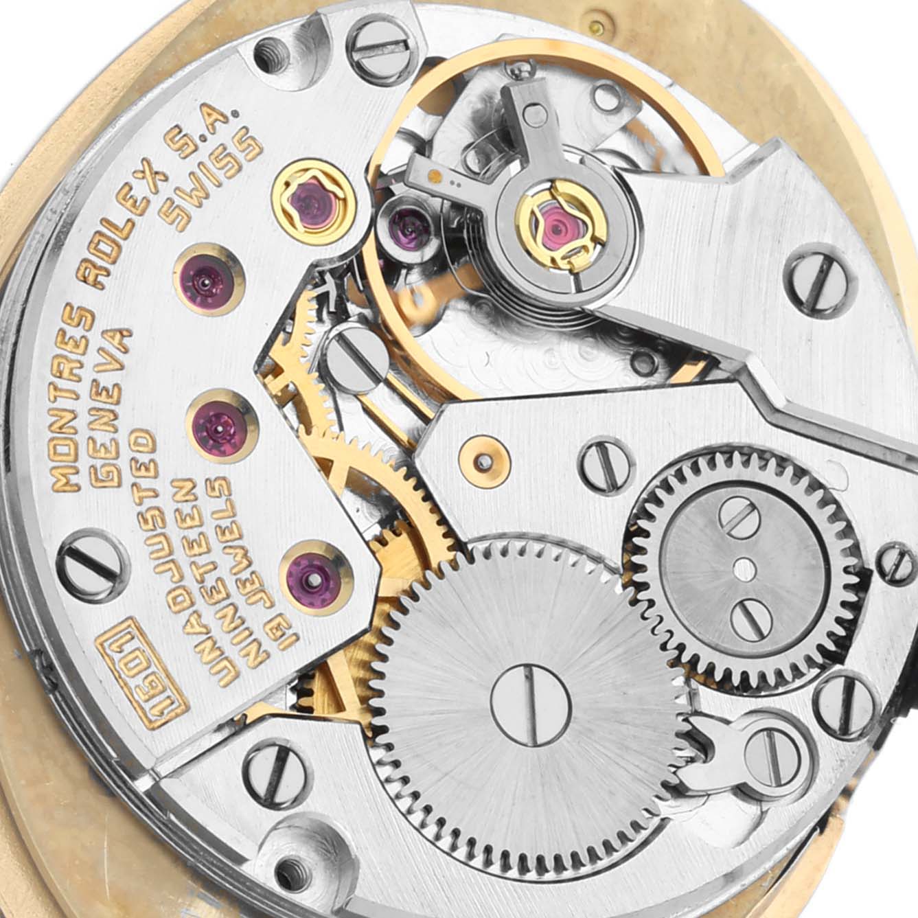 The image shows a close-up of the Rolex Cellini 4307 Women's Yellow Gold Champagne Dial 4307 Women's Yellow Gold Champagne Dial movement, highlighting gears, jewels, and inscriptions.