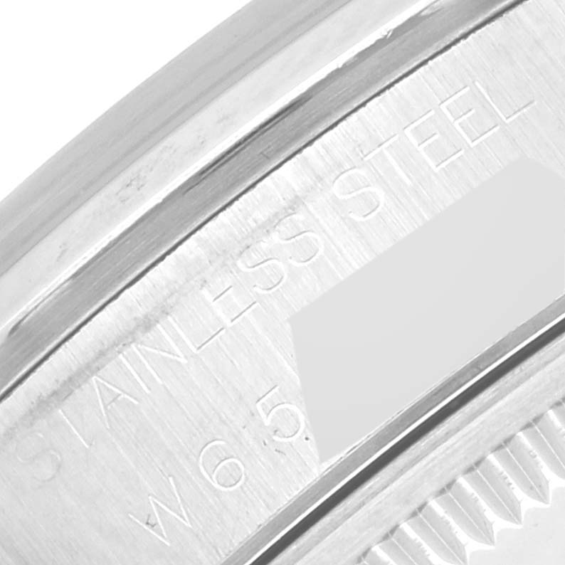 This image shows a close-up of the stainless steel bezel and part of the case back of a Rolex Date 15200 Men's Stainless Steel Blue Dial 15200 Men's Stainless Steel Blue Dial model.