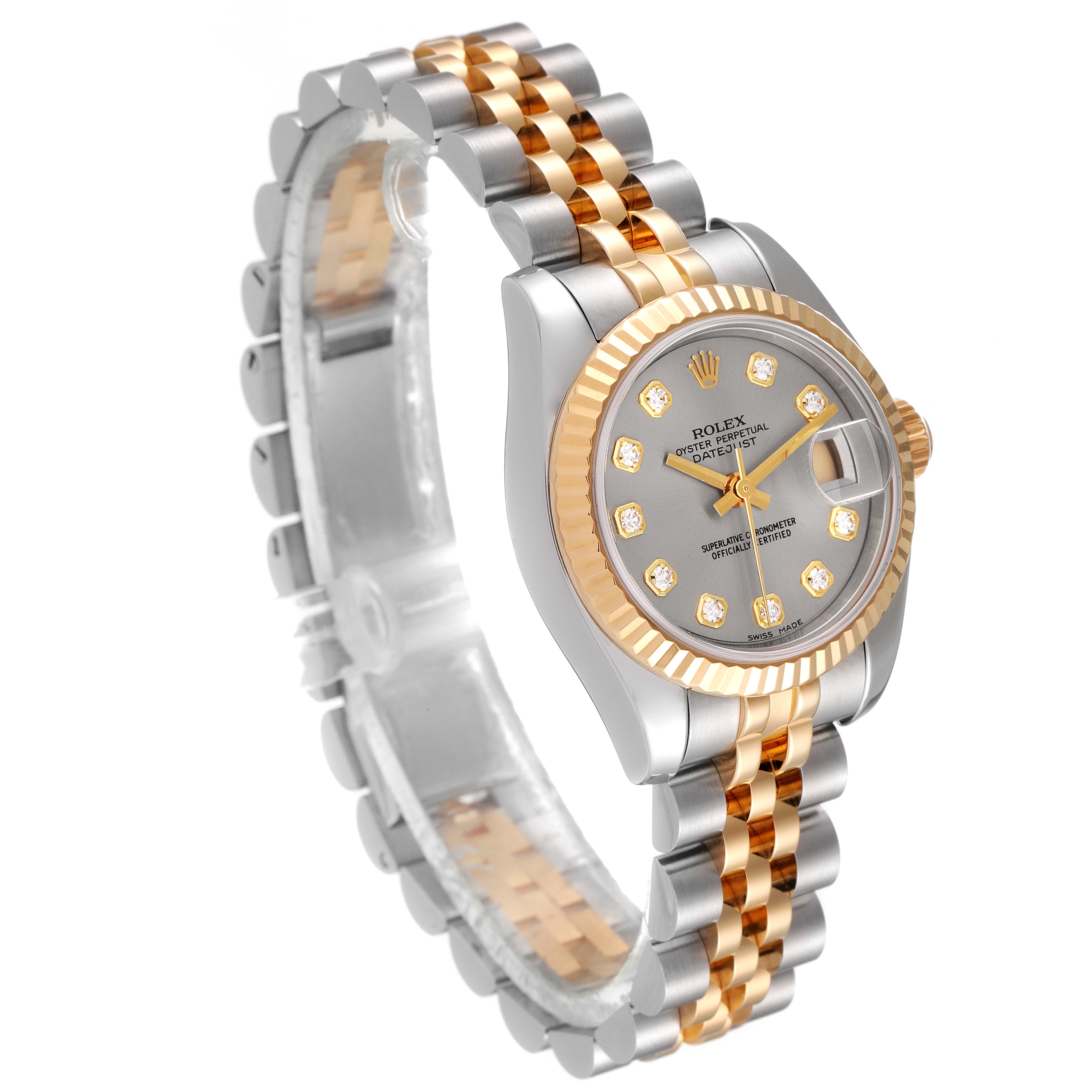 The image shows a Rolex Datejust 179173 Women
s Steel and Gold (two tone) Grey Dial 179173 Women
s Steel and Gold (two tone) Grey Dial watch from a three-quarter angle, highlighting its dial, bezel, and two-tone bracelet.