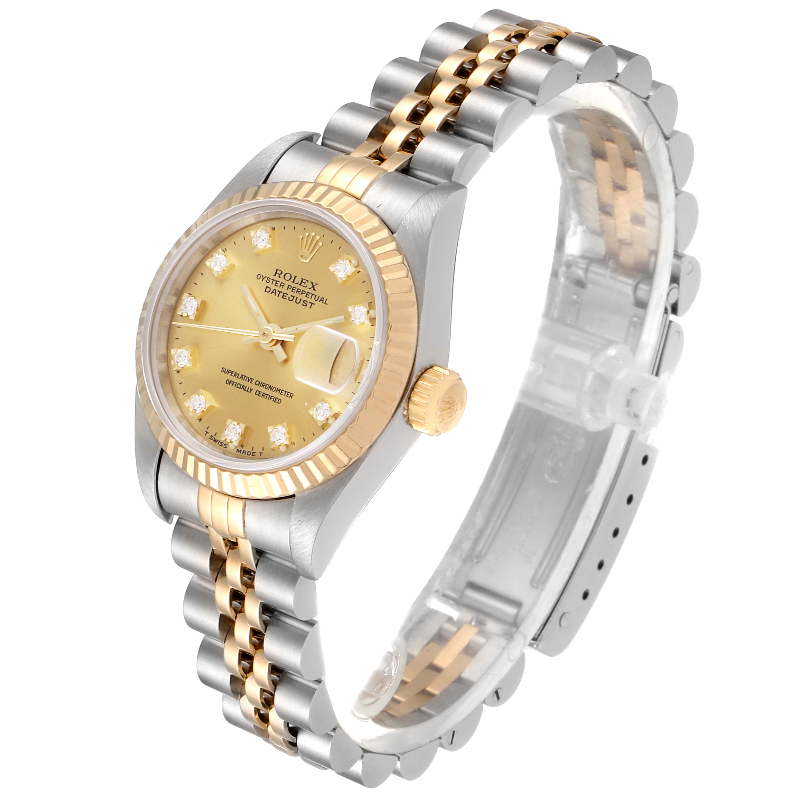 This image shows a Rolex Datejust 69173 Women
s Steel and Gold (two tone) Champagne Dial 69173 Women
s Steel and Gold (two tone) Champagne Dial watch at a slight angle, highlighting its champagne dial, two-tone bracelet, and fluted bezel.