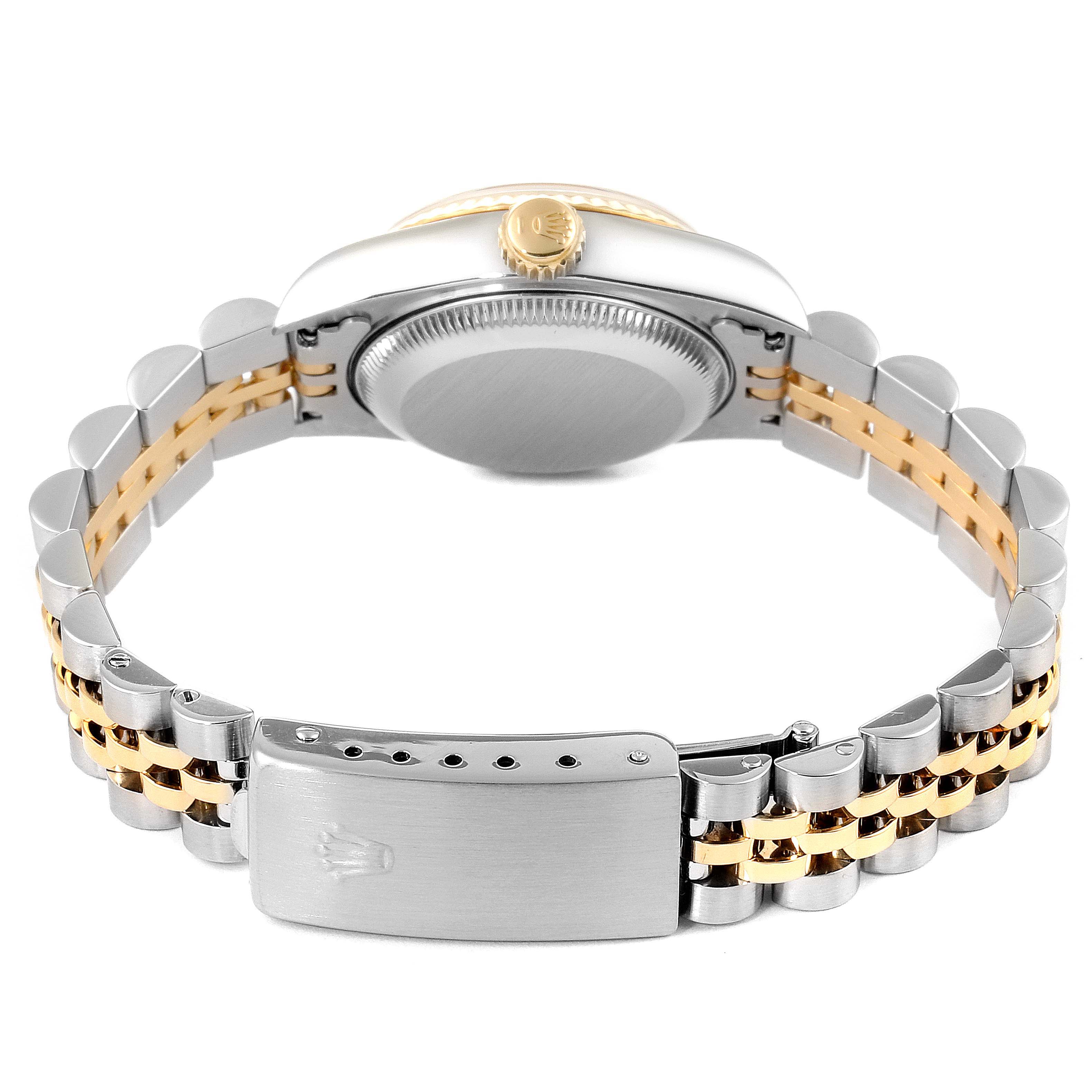 This image shows the back view of the Rolex Datejust 69173 Women
s Steel and Gold (two tone) Champagne Dial 69173 Women
s Steel and Gold (two tone) Champagne Dial watch, featuring its case, crown, and two-tone bracelet.