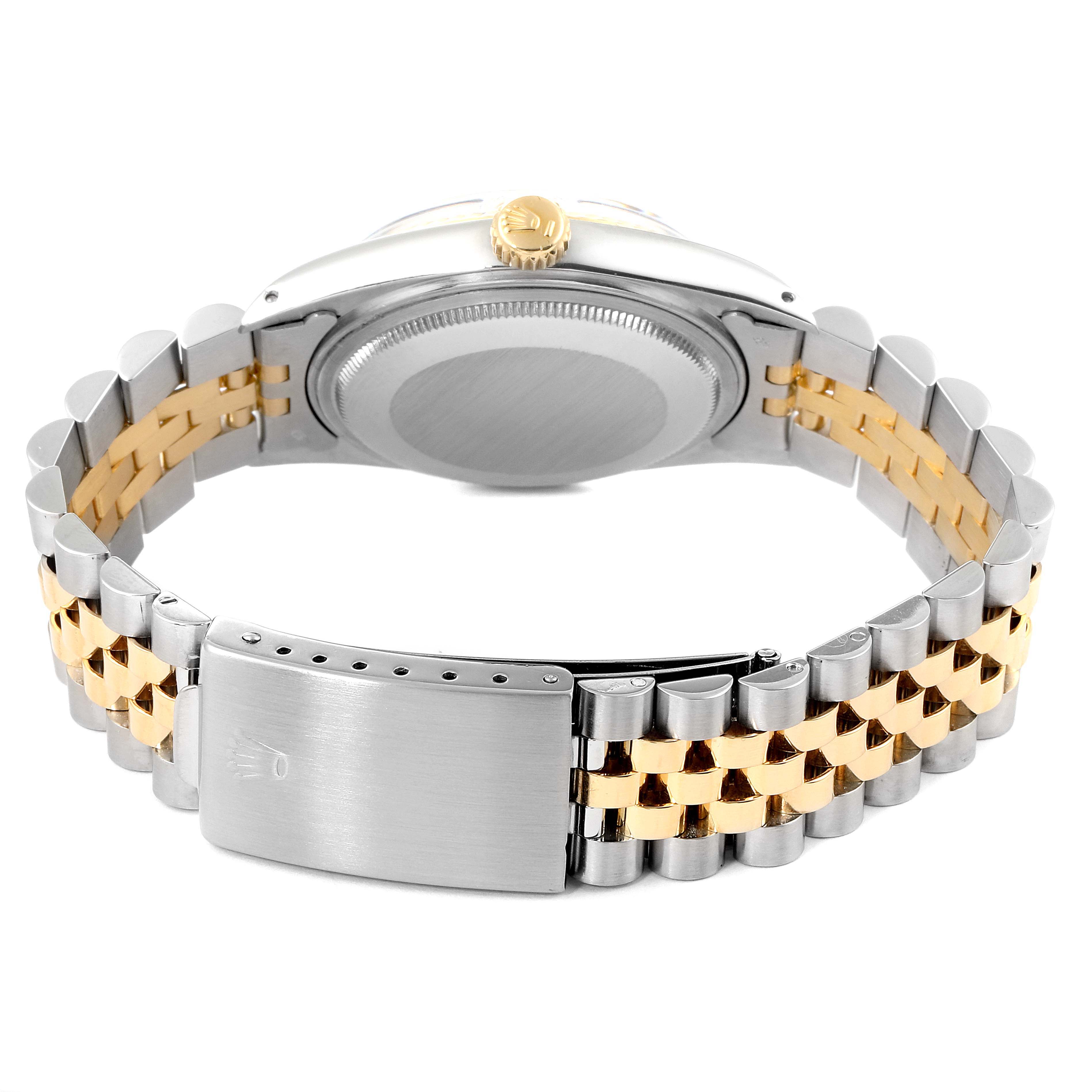 The image shows the back and bracelet of a Rolex Vintage Collection 16013 Men
s Steel and Gold (two tone) Champagne Dial 16013 Men
s Steel and Gold (two tone) Champagne Dial watch, highlighting the two-tone metal design and clasp.