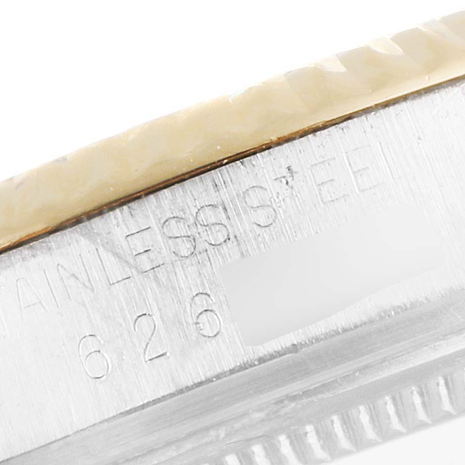 This close-up angled shot of the Rolex Vintage Collection 16013 Men
s Steel and Gold (two tone) Champagne Dial 16013 Men
s Steel and Gold (two tone) Champagne Dial watch shows part of the case with "STAINLESS STEEL 626" engraved.