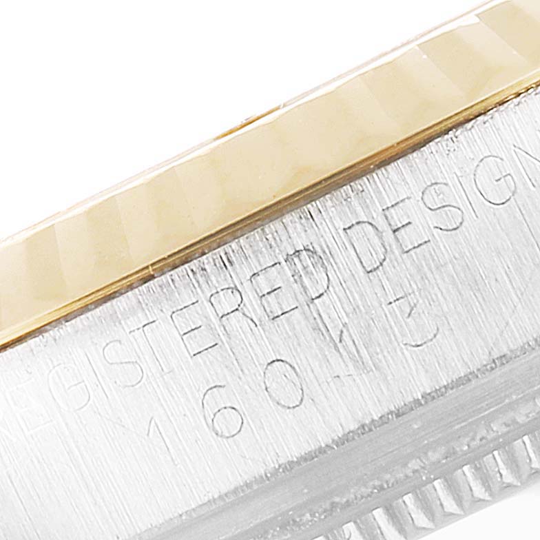 This image shows a close-up of the side of a Rolex Vintage Collection 16013 Men
s Steel and Gold (two tone) Champagne Dial 16013 Men
s Steel and Gold (two tone) Champagne Dial watch, highlighting the case and bezel.