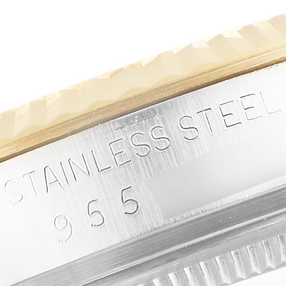 This close-up image shows the side view of the stainless steel bezel and engraved text of a Rolex Vintage Collection 16013 Men's Steel and Gold (two tone) Champagne Dial 16013 Men's Steel and Gold (two tone) Champagne Dial watch.