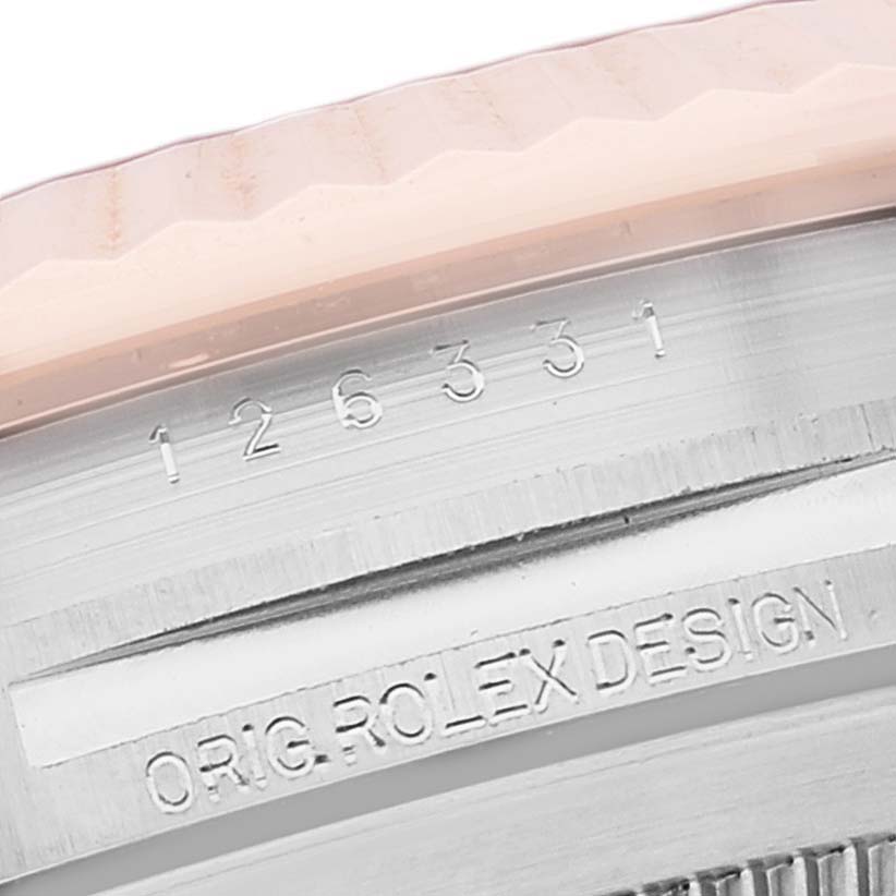 This close-up image shows the model number and "ORIG. ROLEX DESIGN" engraving of the Rolex Datejust 41 126331 Men's Steel and Gold (two tone) Brown Dial 126331 Men's Steel and Gold (two tone) Brown Dial.