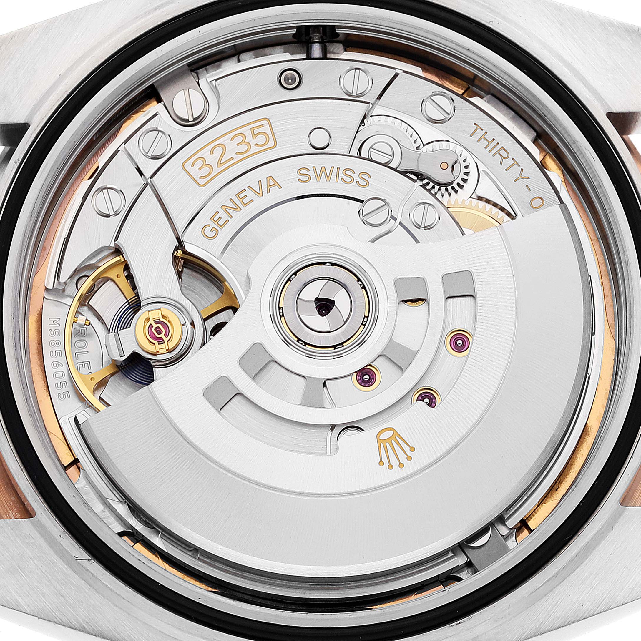 The image shows the intricate movement mechanism of the Rolex Datejust 41 126331 Men's Steel and Gold (two tone) Brown Dial 126331 Men's Steel and Gold (two tone) Brown Dial model from a close-up rear angle.