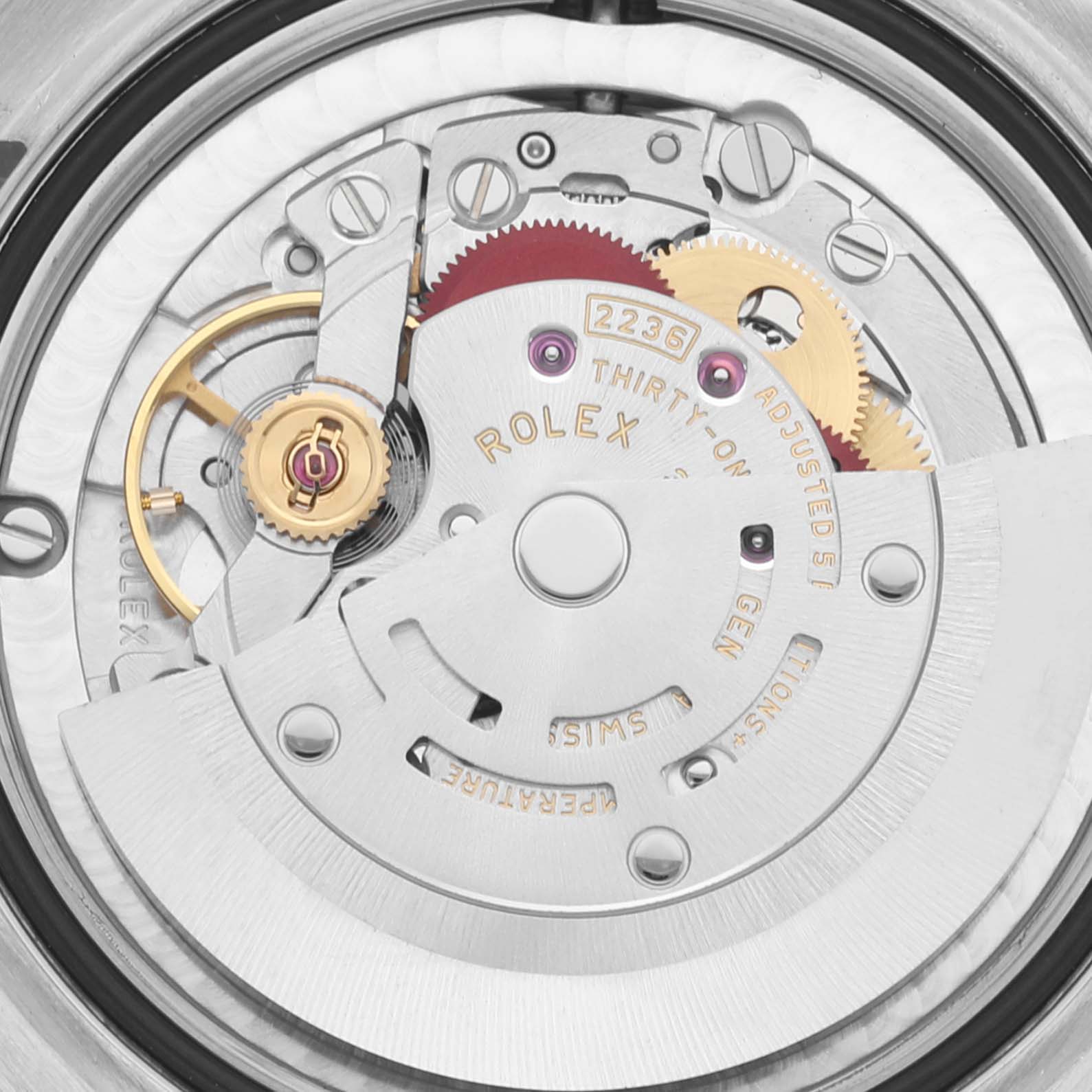 This is a close-up of the Rolex Mid-Size 278344RBR Women's Stainless Steel Grey Dial 278344RBR Women's Stainless Steel Grey Dial watch's internal mechanism, showing gears and the rotor.