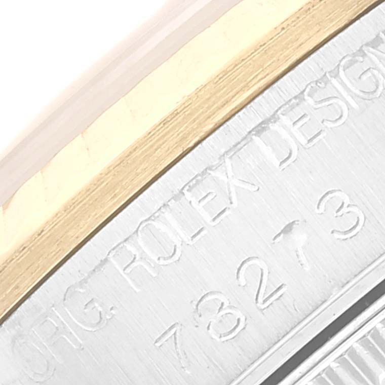 This image shows a close-up of the side of a Mid-Size Rolex watch, revealing part of the model number and "ORIG. ROLEX DESIGN" engraving.