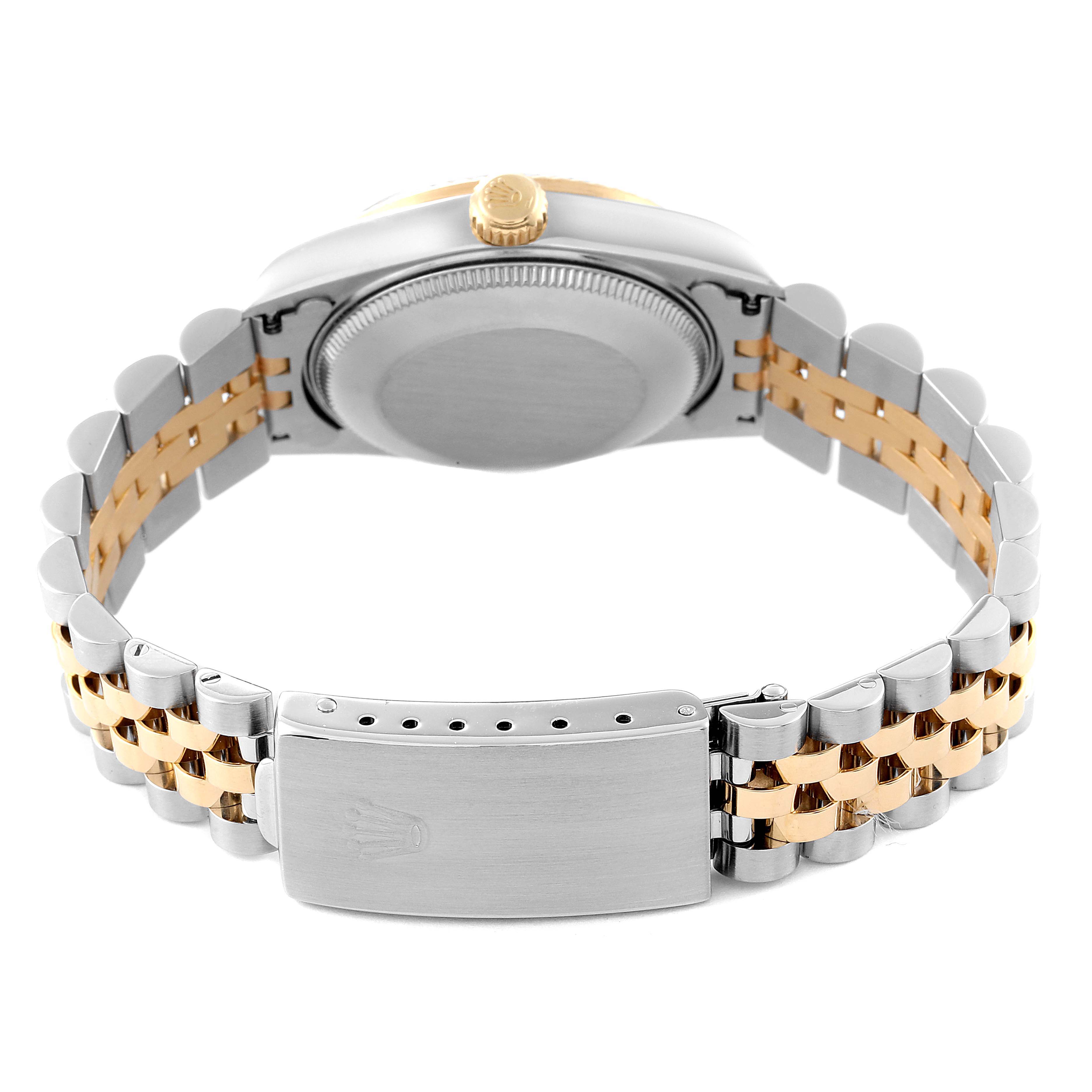 This image shows the back of a mid-size Rolex watch, focusing on the case back, crown, and two-tone bracelet with the clasp.