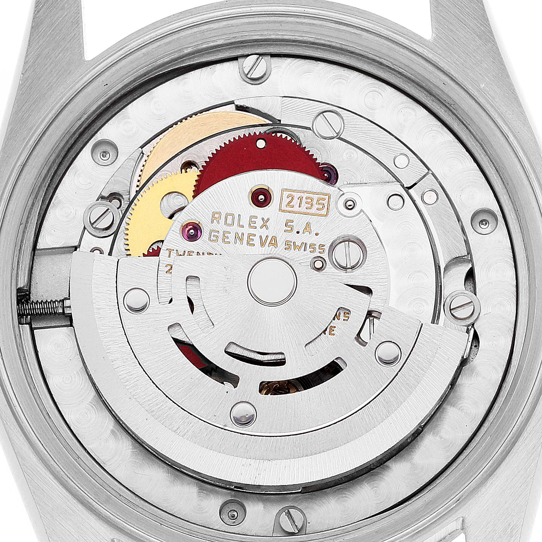 This image shows the intricate movement and internal mechanism of the mid-size Rolex watch from a rear, open-case angle.