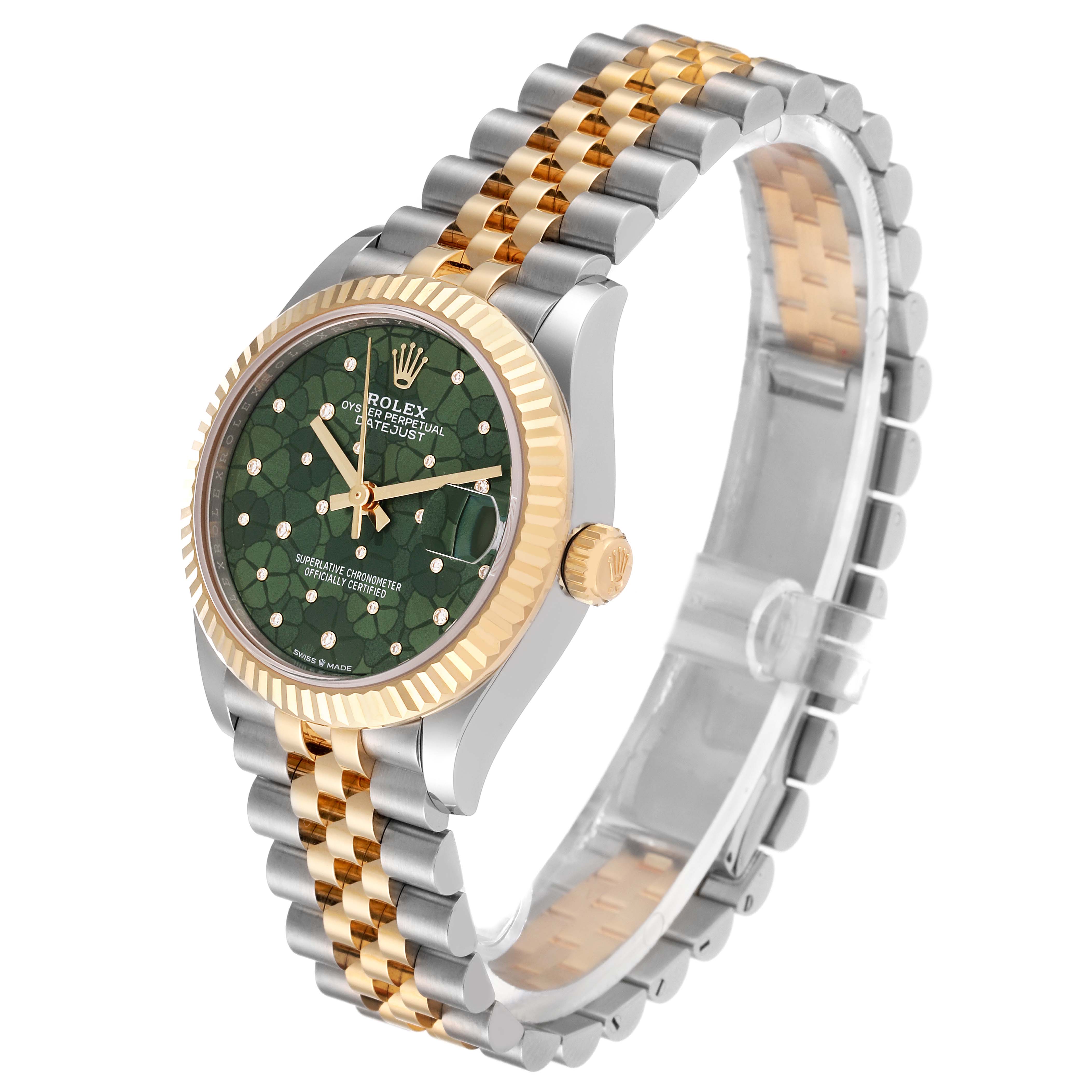 The image shows a Mid-Size Rolex watch from an angled side view, highlighting its green dial, gold fluted bezel, and two-tone jubilee bracelet.