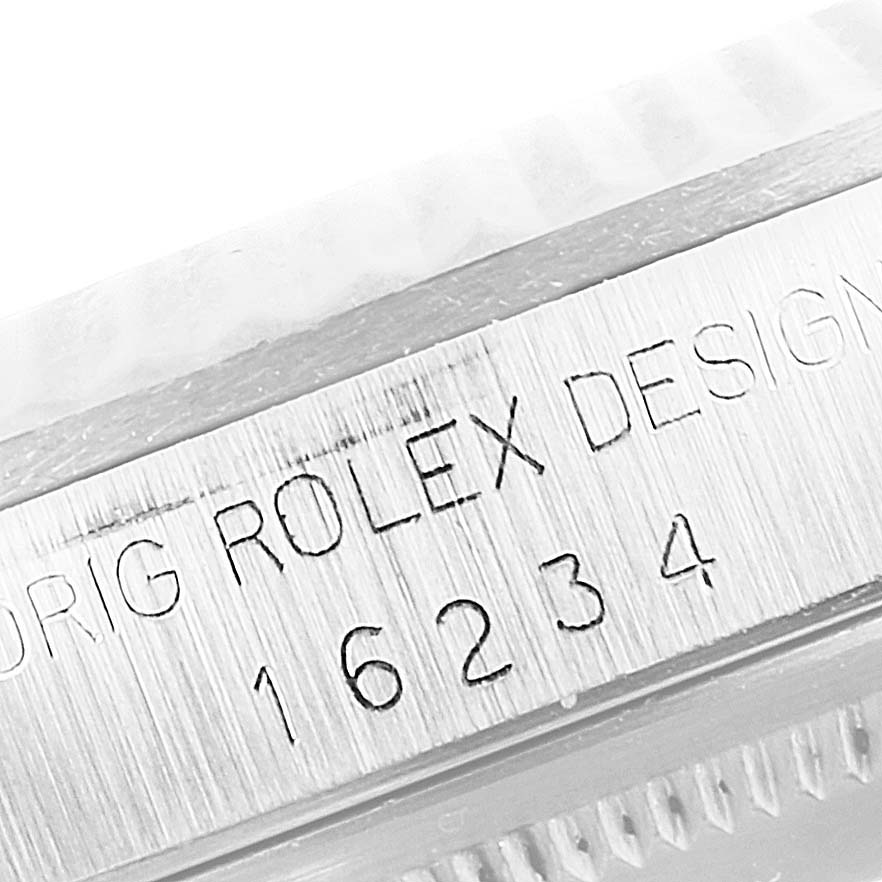 The image shows a close-up of the side of the Rolex Datejust 16234 Men's Stainless Steel Silver Dial 16234 Men's Stainless Steel Silver Dial model, displaying its engraved model number "16234".