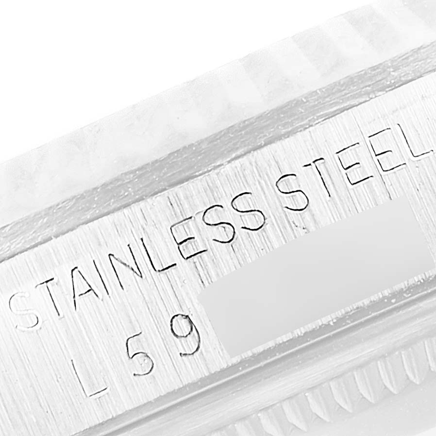 The image shows a close-up of the stainless steel engraving on the bezel of a Rolex Datejust 16234 Men's Stainless Steel Silver Dial 16234 Men's Stainless Steel Silver Dial watch.