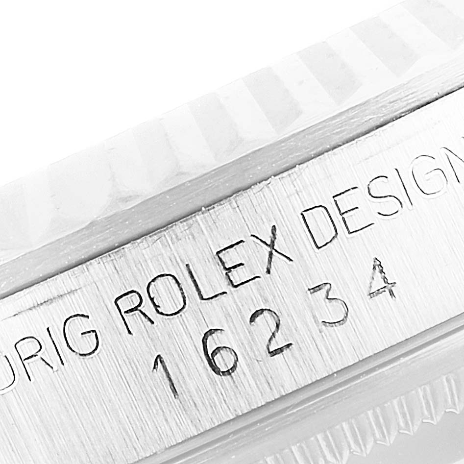 This is a close-up image of the serial number and model engraving on the side of the Rolex Datejust 16234 Men's Stainless Steel Silver Dial 16234 Men's Stainless Steel Silver Dial watch bezel.
