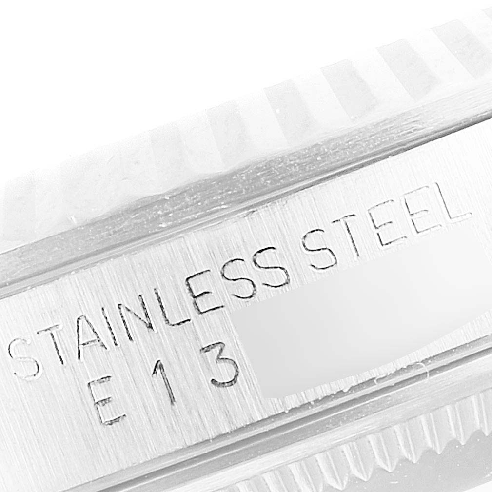 The image shows a close-up of the stainless steel casing and part of the fluted bezel of a Rolex Datejust 16234 Men's Stainless Steel Silver Dial 16234 Men's Stainless Steel Silver Dial watch.