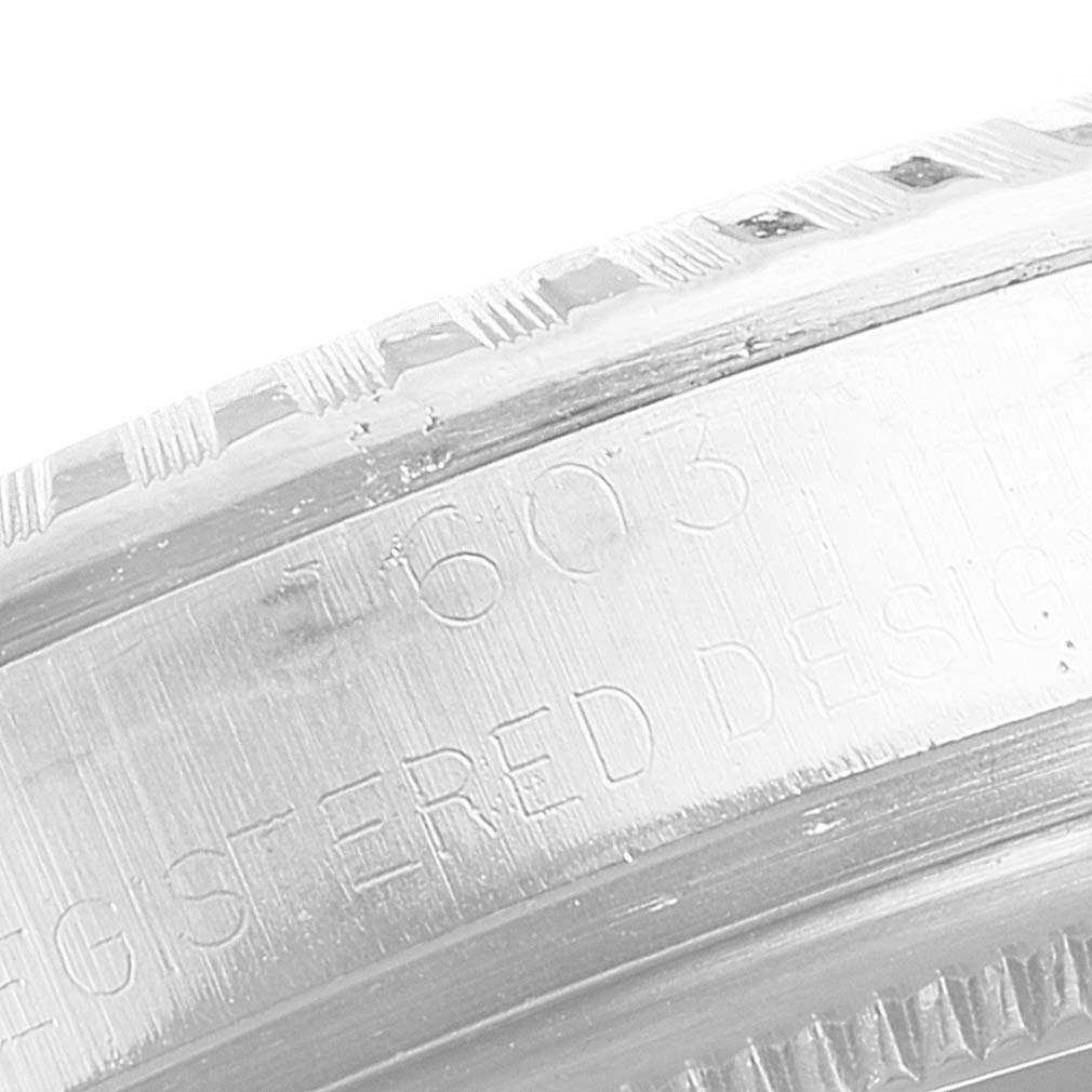 This image shows an extreme close-up of the engraved bezel on a Vintage Collection model watch by Rolex.