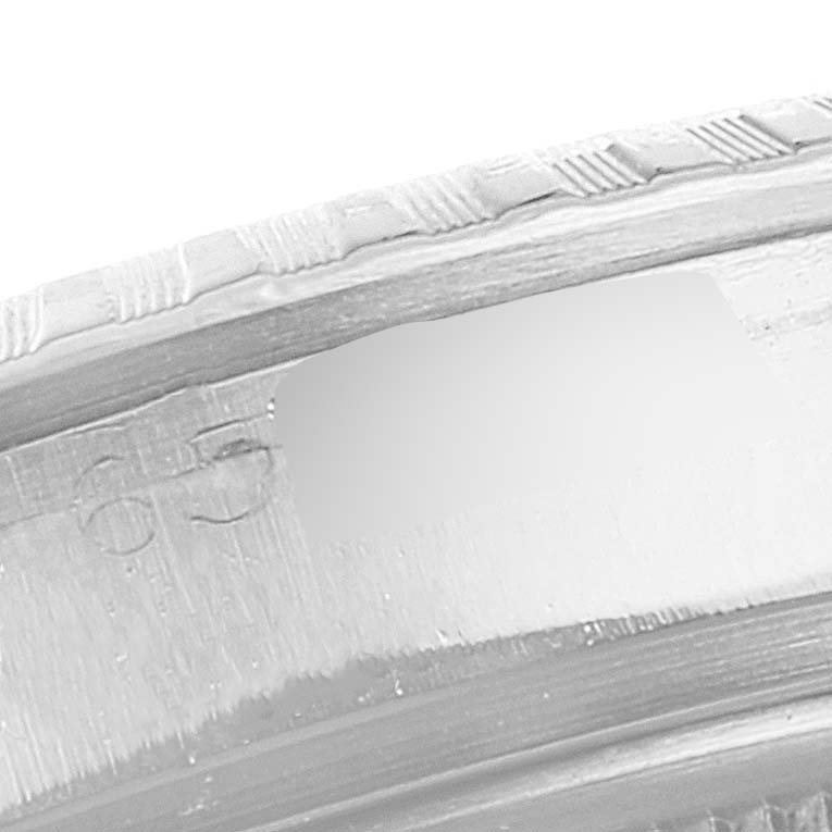 This is a close-up image showing the edge and engraving details of a Rolex Vintage Collection 1603 Men
s Stainless Steel Silver Dial 1603 Men
s Stainless Steel Silver Dial watch.