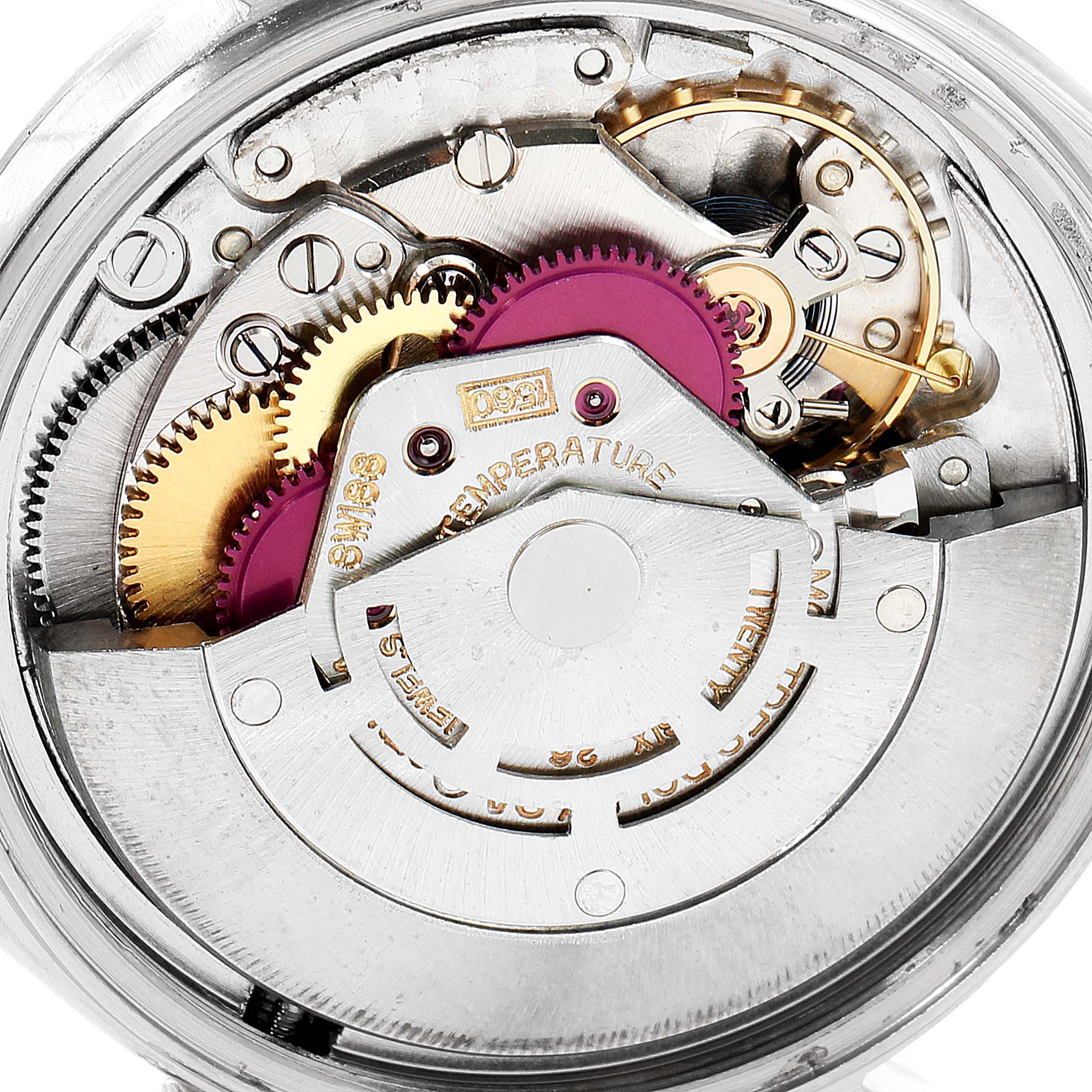 This image shows the intricate internal movement mechanism of a Rolex Vintage Collection 1603 Men
s Stainless Steel Silver Dial 1603 Men
s Stainless Steel Silver Dial watch from a close-up angle.
