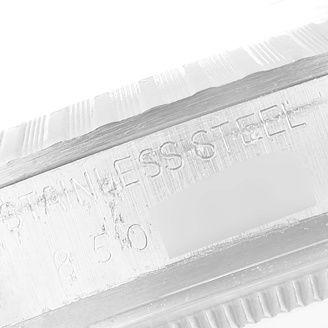 This close-up image shows the stainless steel case side with engravings of the Rolex Vintage Collection 16030 Men's Stainless Steel Silver Dial 16030 Men's Stainless Steel Silver Dial watch.