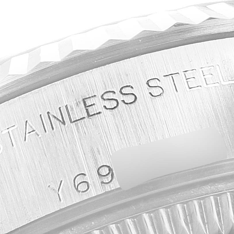 The image shows a close-up of the bezel and rehaut engraving on a Rolex Datejust 79174 Women's Stainless Steel Black Dial 79174 Women's Stainless Steel Black Dial watch.