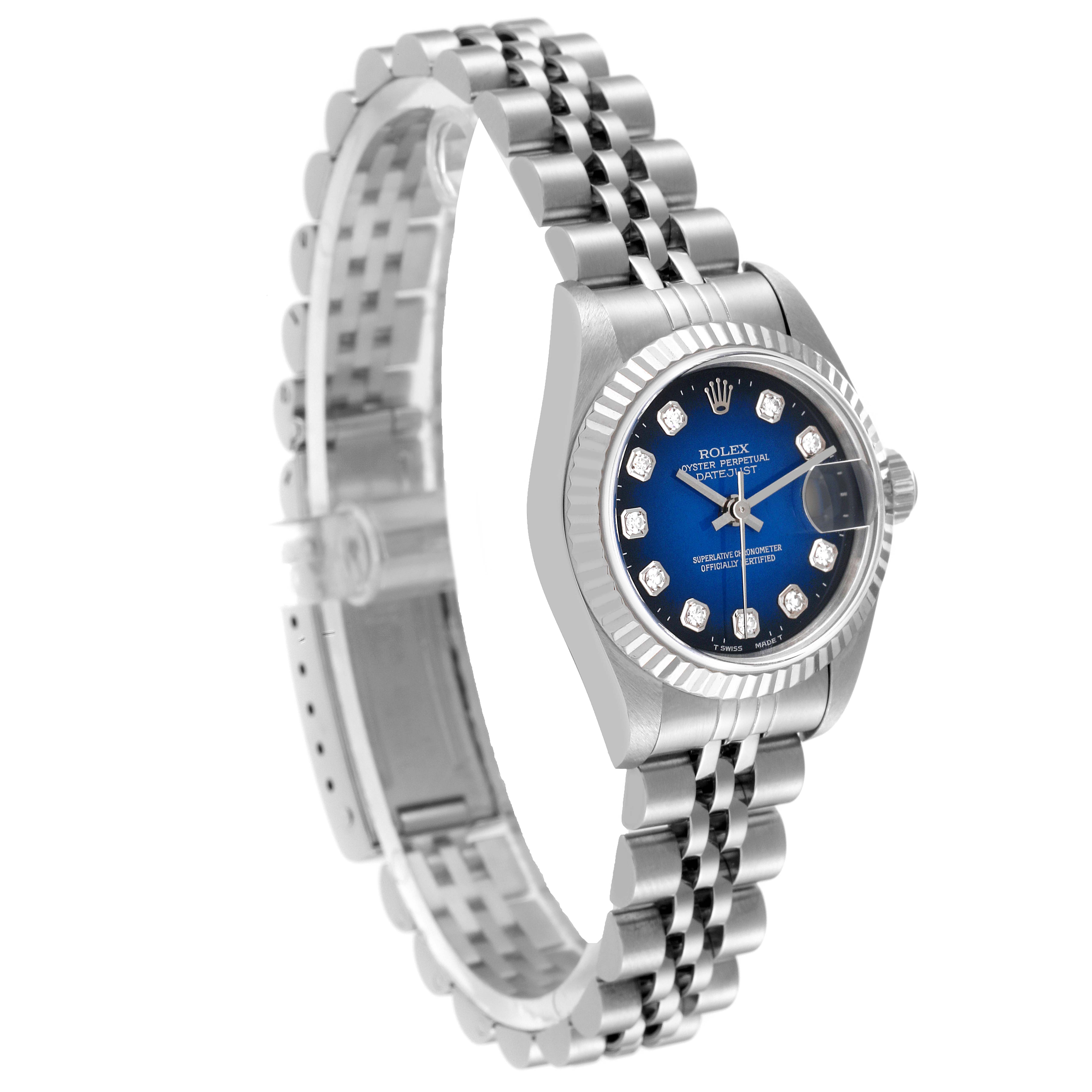 This image shows a Rolex Datejust 79174 Women's Stainless Steel Blue Dial 79174 Women's Stainless Steel Blue Dial watch from a three-quarter angle, displaying the face, bezel, and steel bracelet.