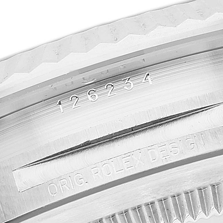 This image shows a close-up of the bezel and case of the Rolex Datejust 126234 Men's Stainless Steel Grey Dial 126234 Men's Stainless Steel Grey Dial watch, displaying the model number and "ORIG. ROLEX DESIGN" engraving.