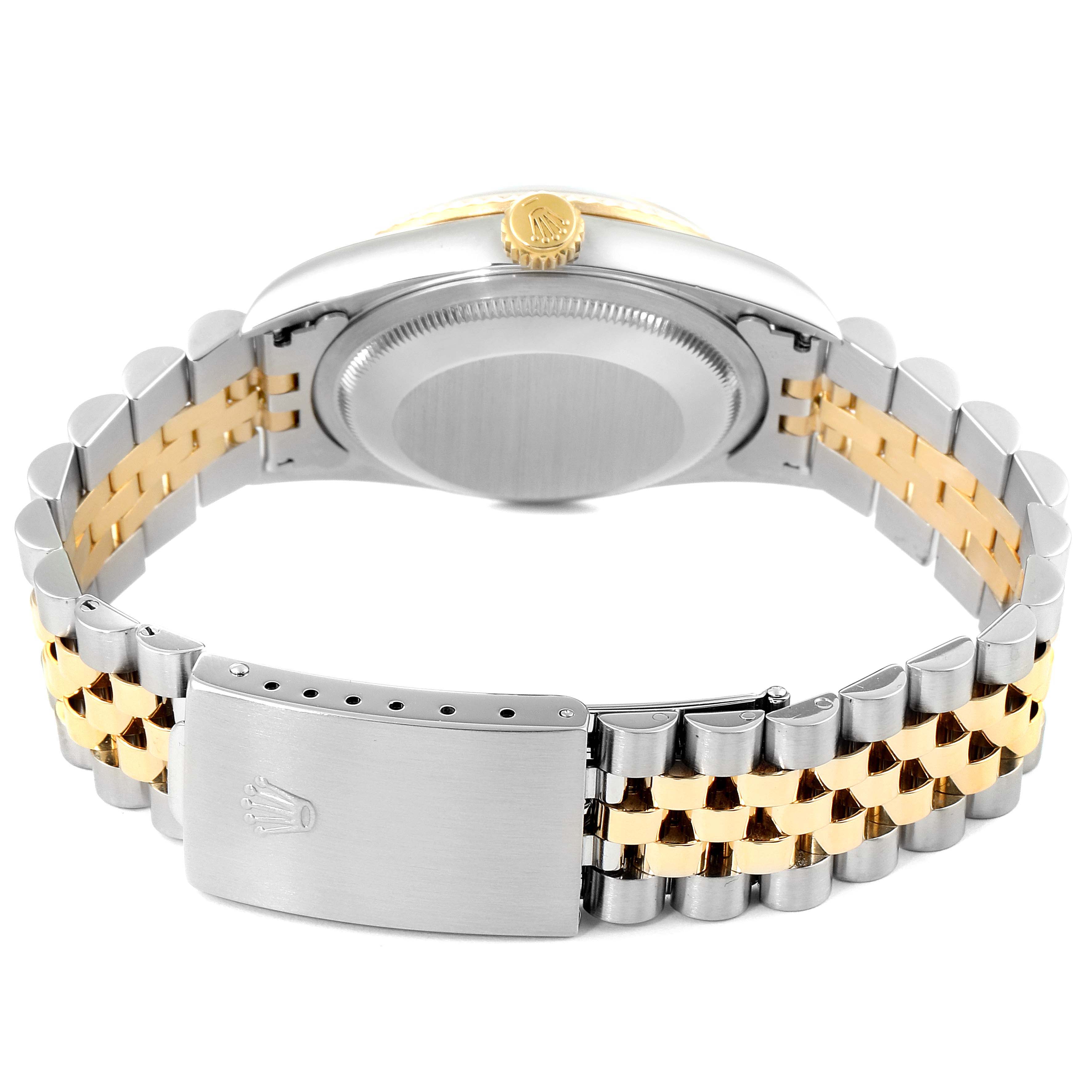 The image shows the back view of a Rolex Datejust 16233 Men's Steel and Gold (two tone) Black Dial 16233 Men's Steel and Gold (two tone) Black Dial watch, featuring its two-tone bracelet, case back, and clasp.