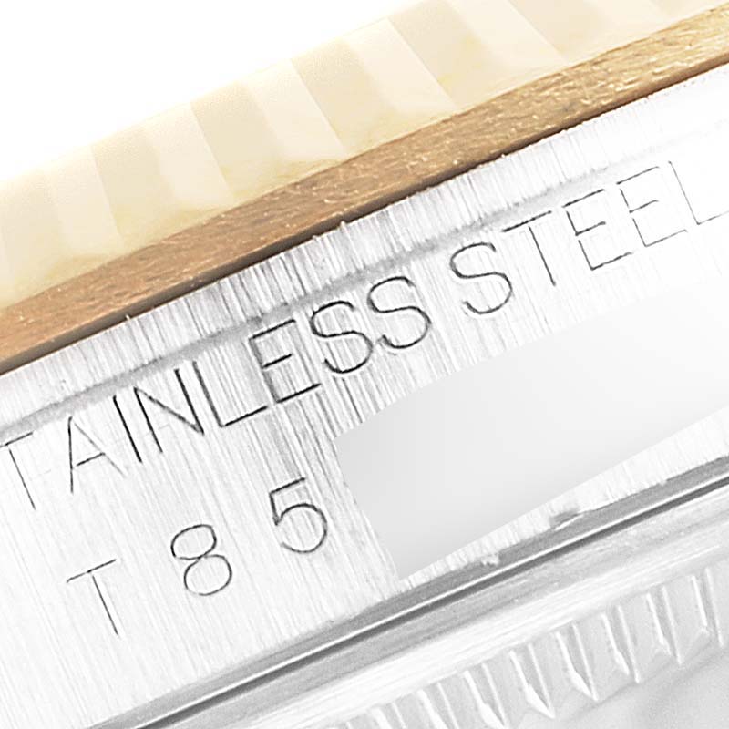 This close-up image of a Rolex Datejust 16233 Men's Steel and Gold (two tone) Black Dial 16233 Men's Steel and Gold (two tone) Black Dial model shows the engraved stainless steel text on the side of the case.