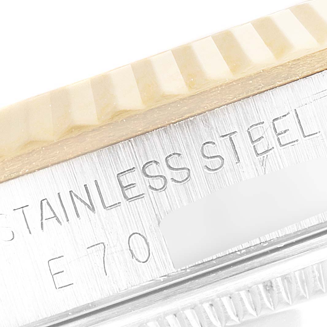 This macro image shows the stainless steel case side and fluted bezel of a Rolex Datejust 16233 Men's Steel and Gold (two tone) Black Dial 16233 Men's Steel and Gold (two tone) Black Dial watch.