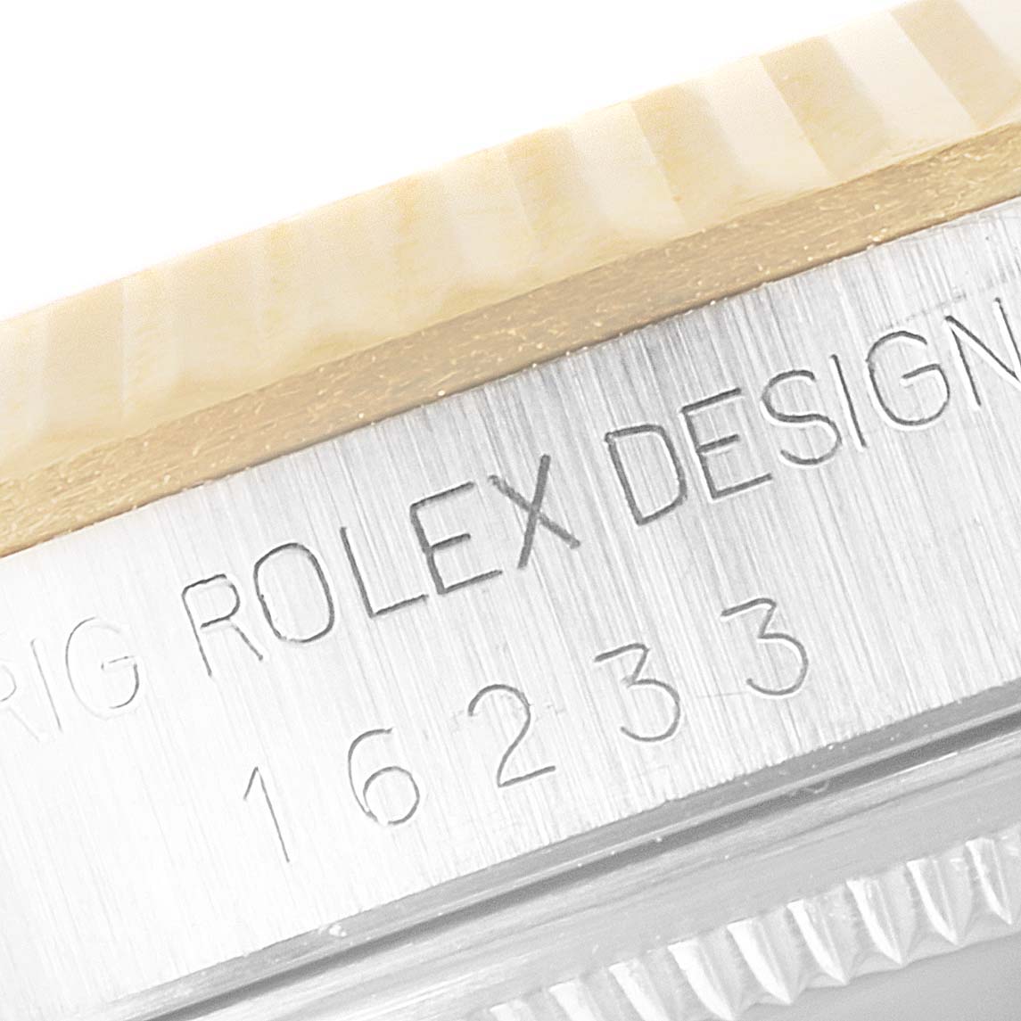 Close-up image of a Rolex Datejust 16233 Men's Steel and Gold (two tone) Black Dial 16233 Men's Steel and Gold (two tone) Black Dial model showing the bezel and engraved case with the model number "16233".
