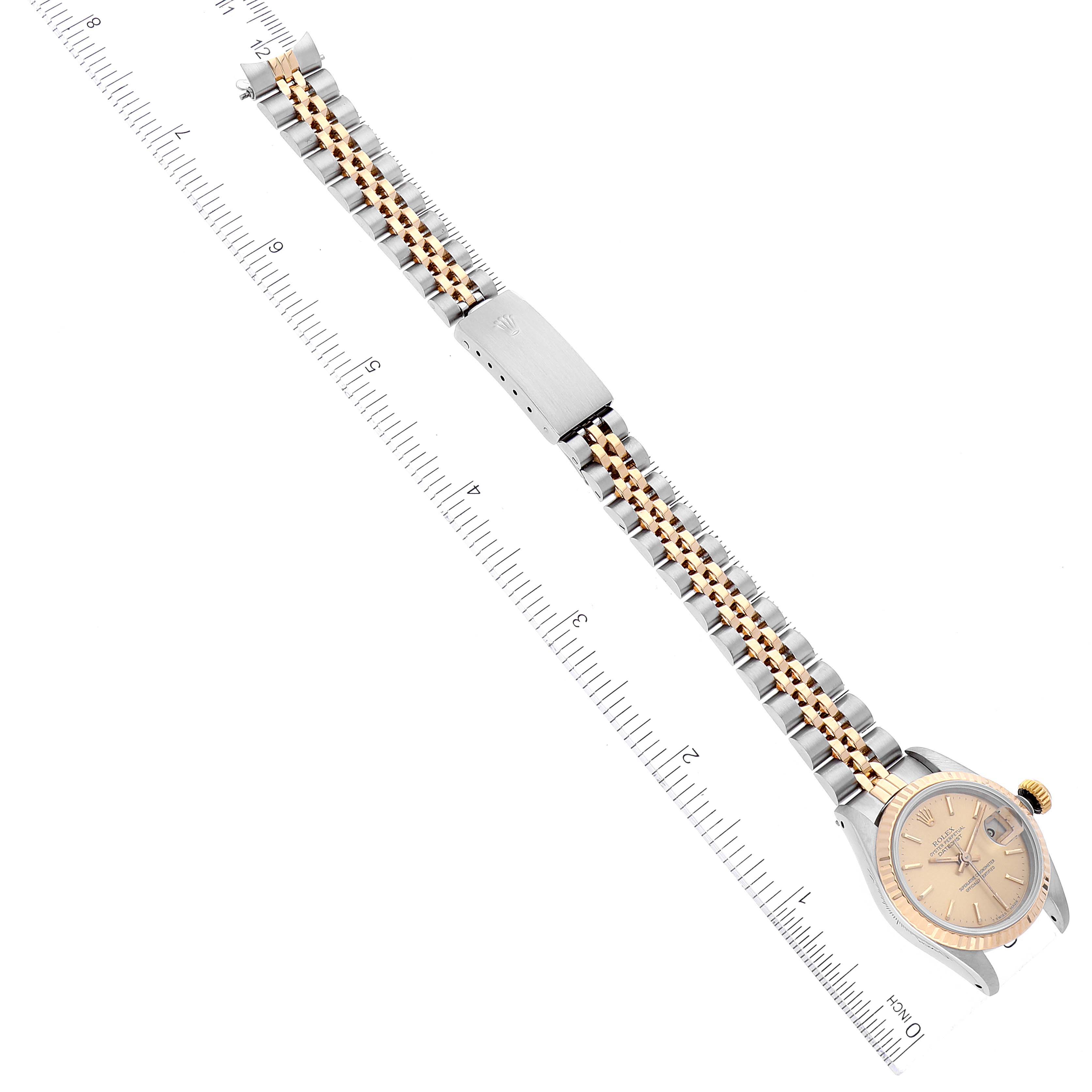 This top-down view shows the Rolex Datejust 69173 Women's Steel and Gold (two tone) Champagne Dial 69173 Women's Steel and Gold (two tone) Champagne Dial watch, focusing on the face, bracelet, and part of the secured clasp.
