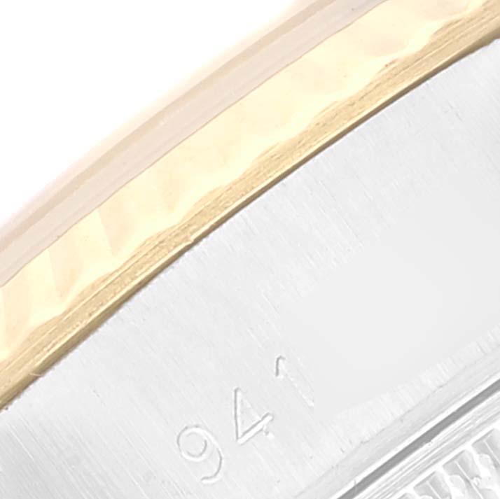 This close-up image shows a portion of the bezel and case of the Rolex Datejust 69173 Women's Steel and Gold (two tone) Champagne Dial 69173 Women's Steel and Gold (two tone) Champagne Dial watch, highlighting part of its reference number.