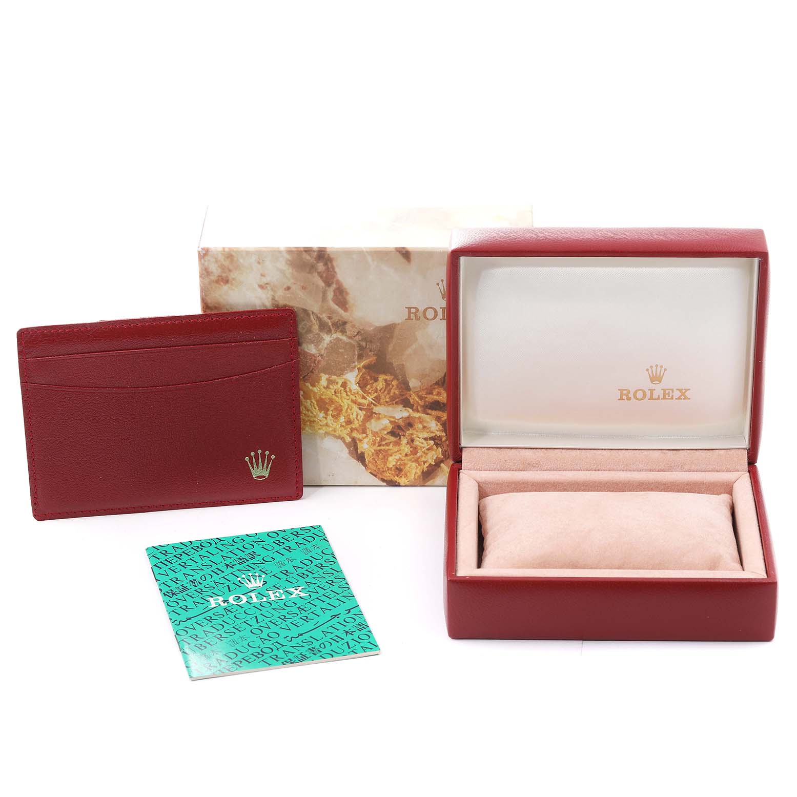 The image shows the accessories for a Rolex Datejust 69173 Women's Steel and Gold (two tone) Champagne Dial 69173 Women's Steel and Gold (two tone) Champagne Dial, including the box, card holder, and documentation from a front angle.